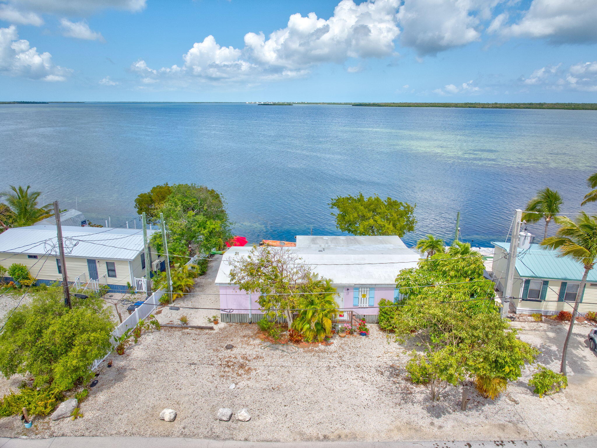 27941 Porgie Path Summerland Key, FL 33042 - Photo 18 of 18 a front view of a house with garden