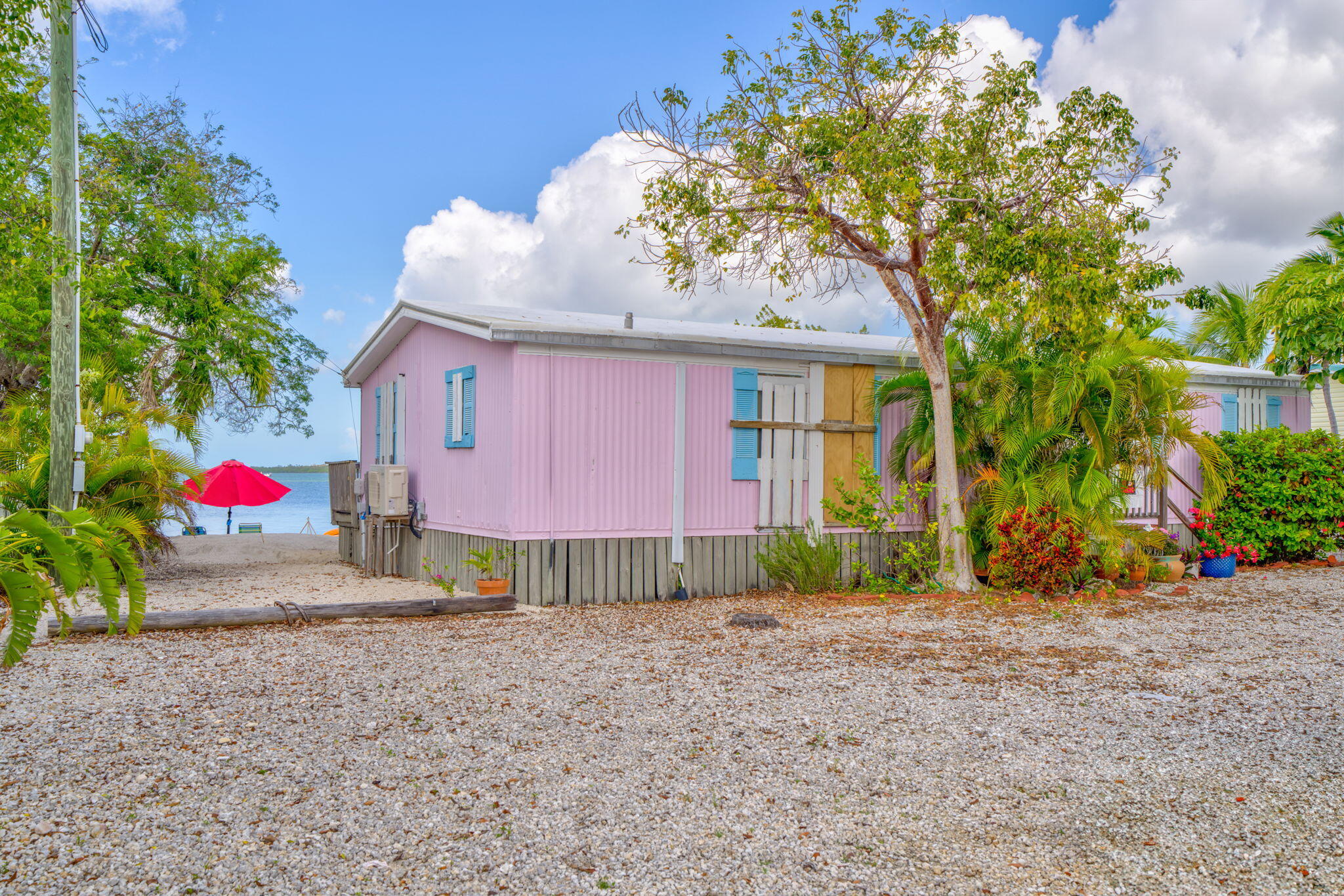 27941 Porgie Path Summerland Key, FL 33042 - Photo 3 of 18 a house view with a garden space
