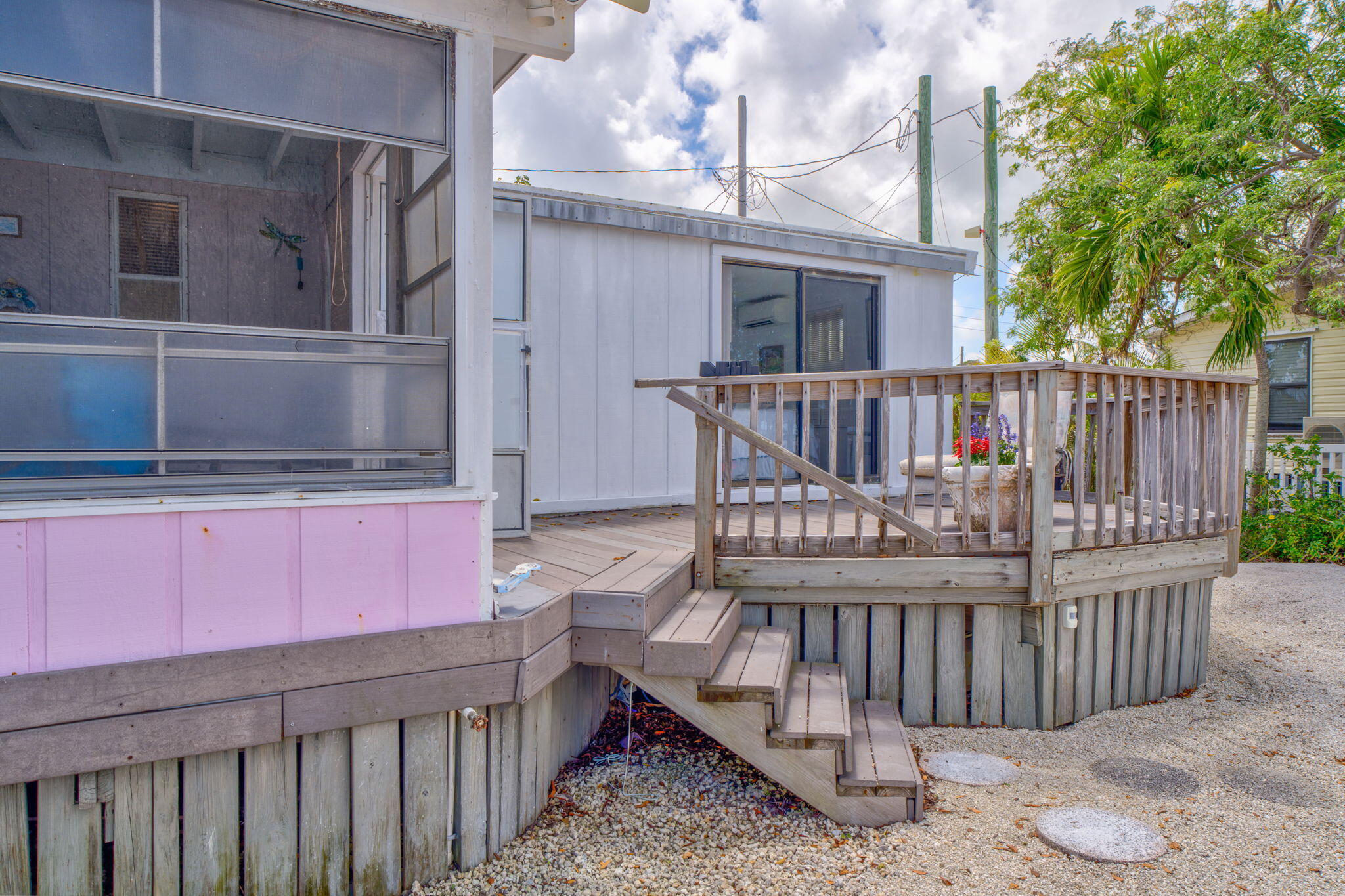 27941 Porgie Path Summerland Key, FL 33042 - Photo 8 of 18 a view of a deck with wooden fence and floor