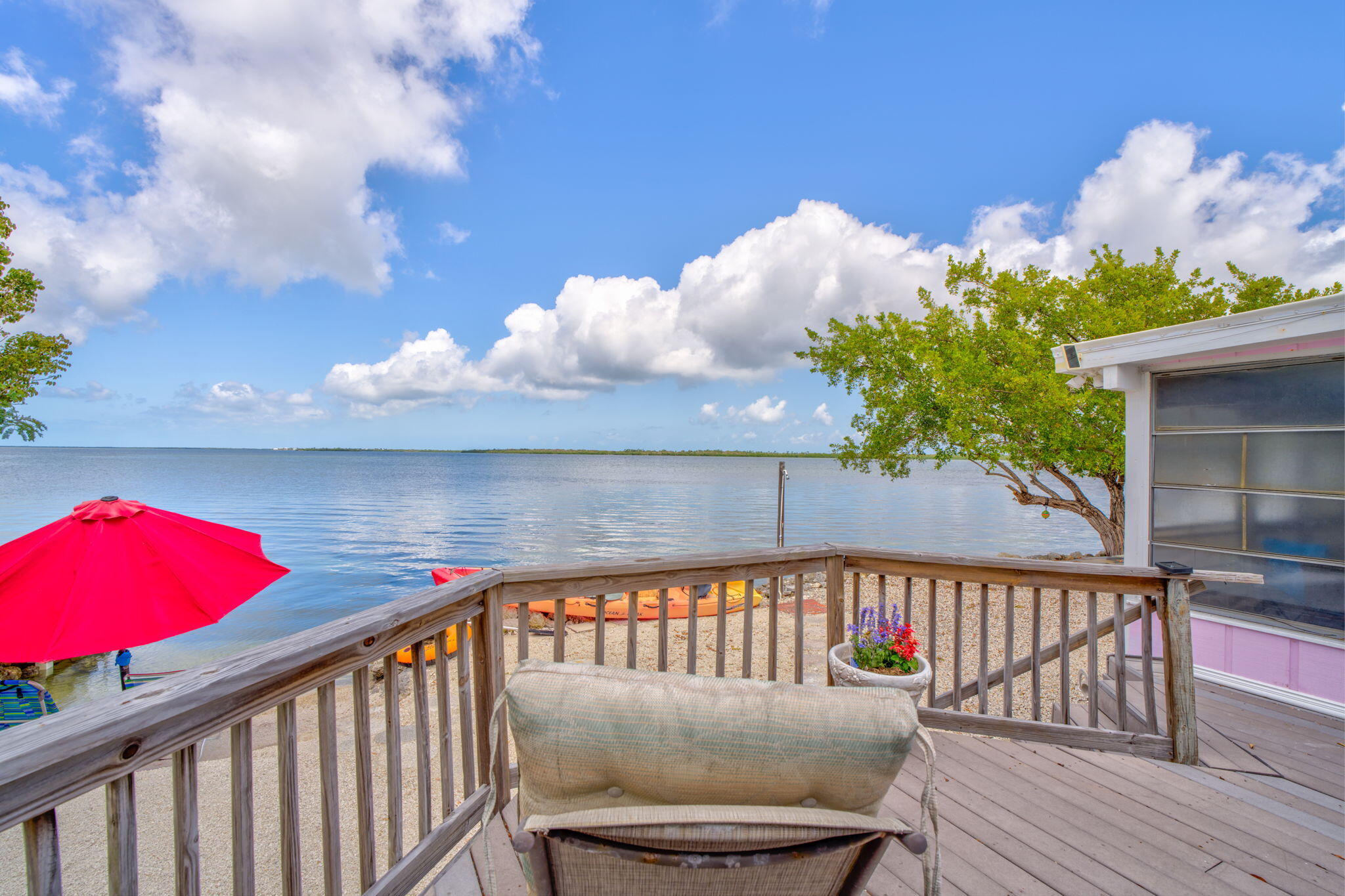 27941 Porgie Path Summerland Key, FL 33042 - Photo 10 of 18 a view of a balcony with flower plants