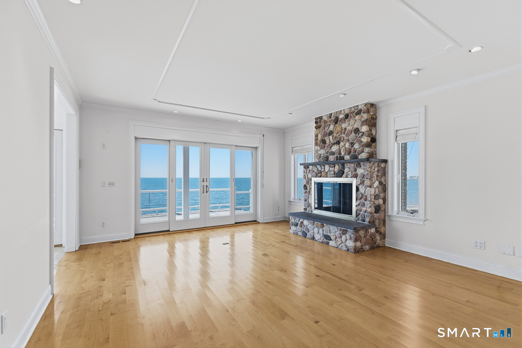Custom stone fireplace in main living room can be wood or propane fired
