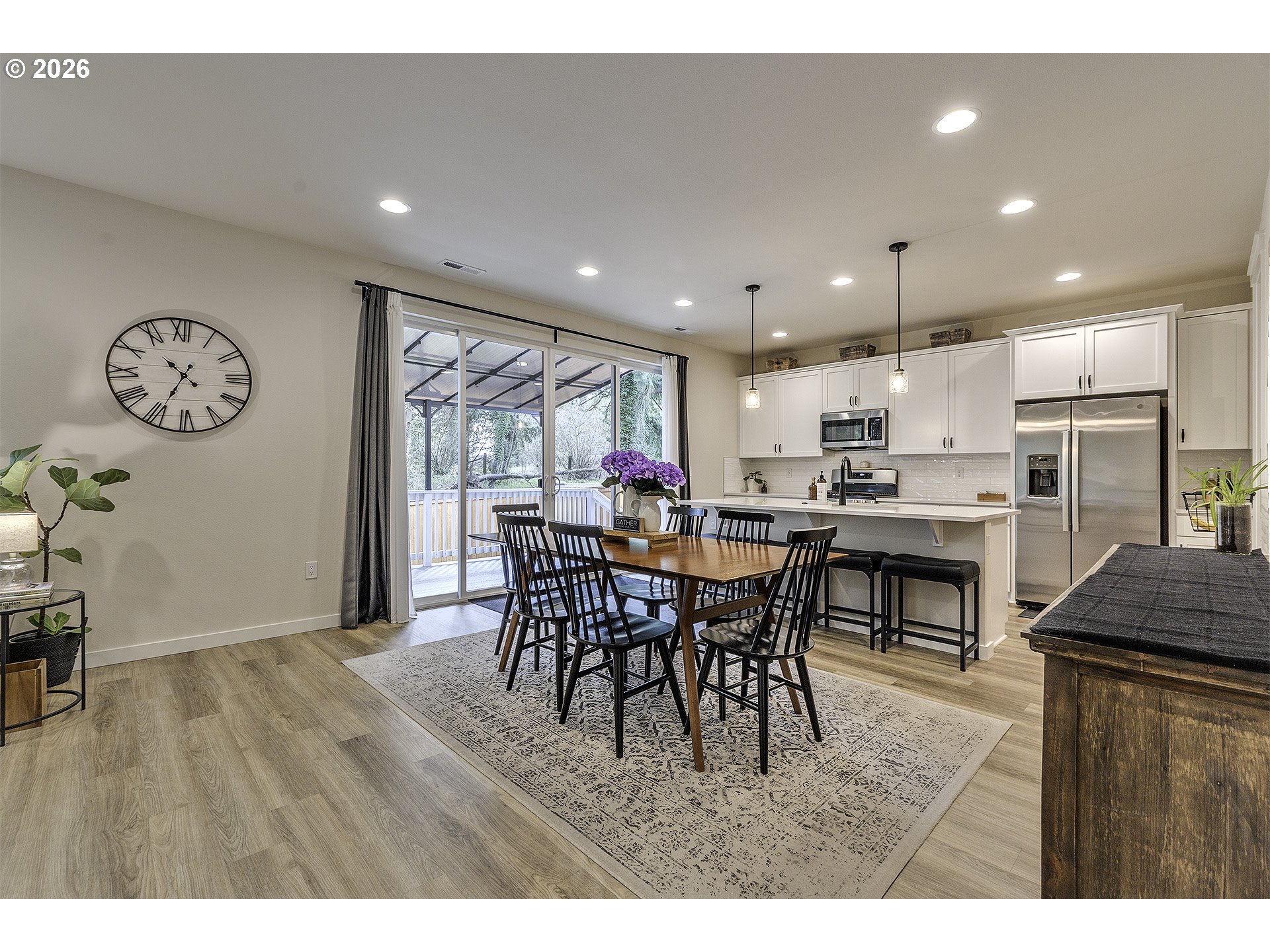 1156 Tansy Lane Canby, OR 97013 - Photo 11 of 35 a view of a dining room with furniture window and wooden floor