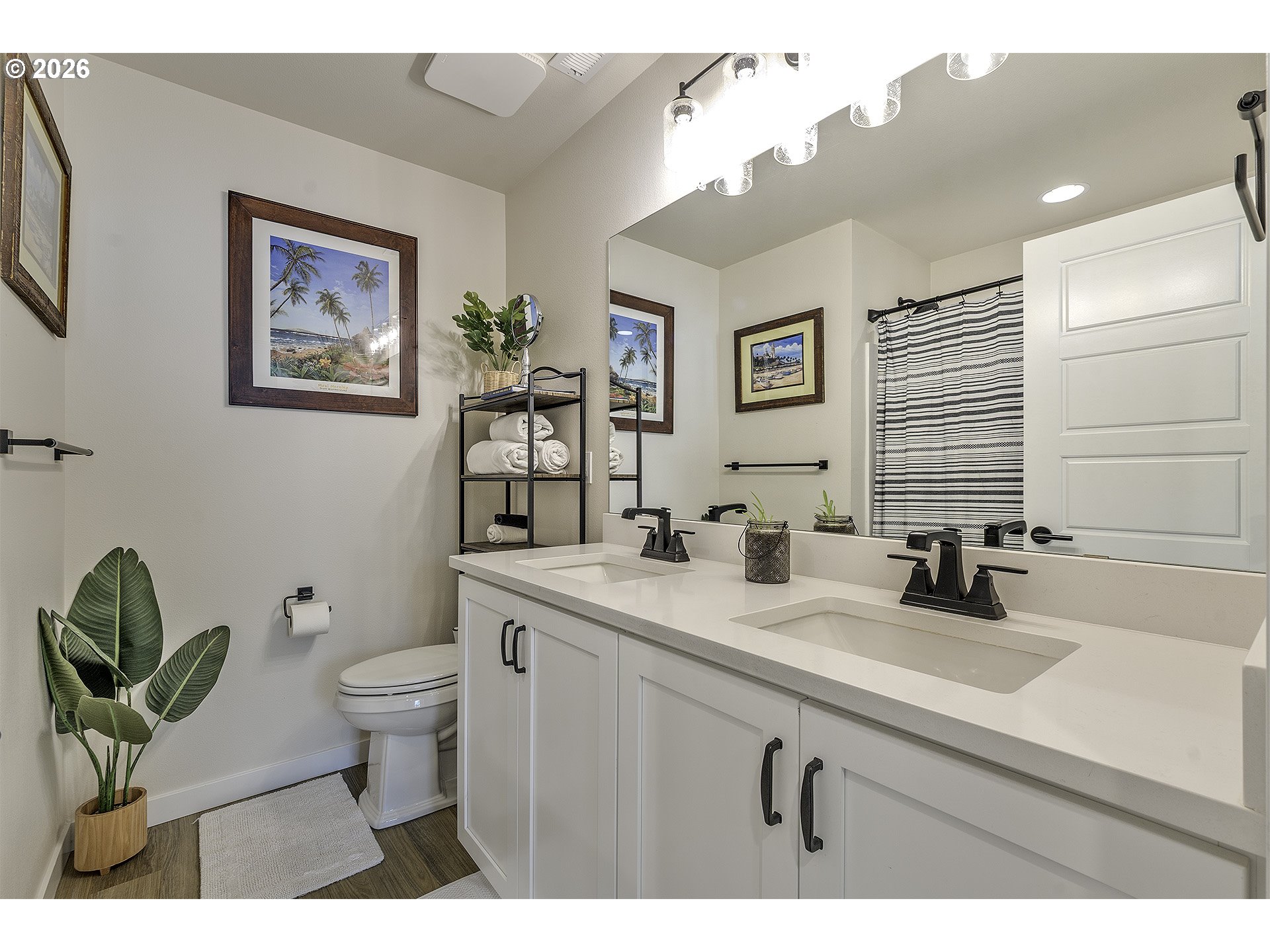 1156 Tansy Lane Canby, OR 97013 - Photo 27 of 35 a bathroom with a toilet a sink a mirror and vanity