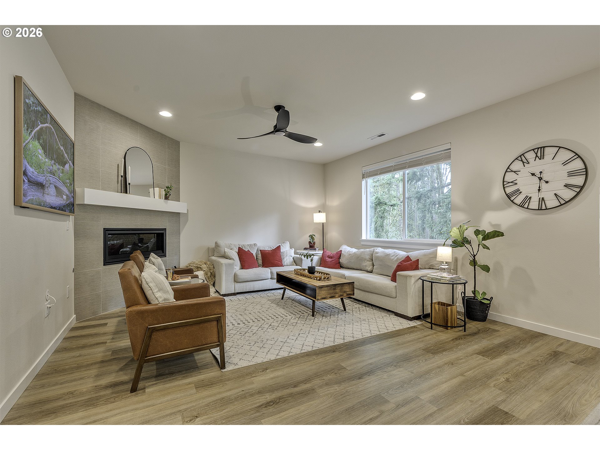 1156 Tansy Lane Canby, OR 97013 - Photo 7 of 35 a living room with furniture a fireplace and a large window
