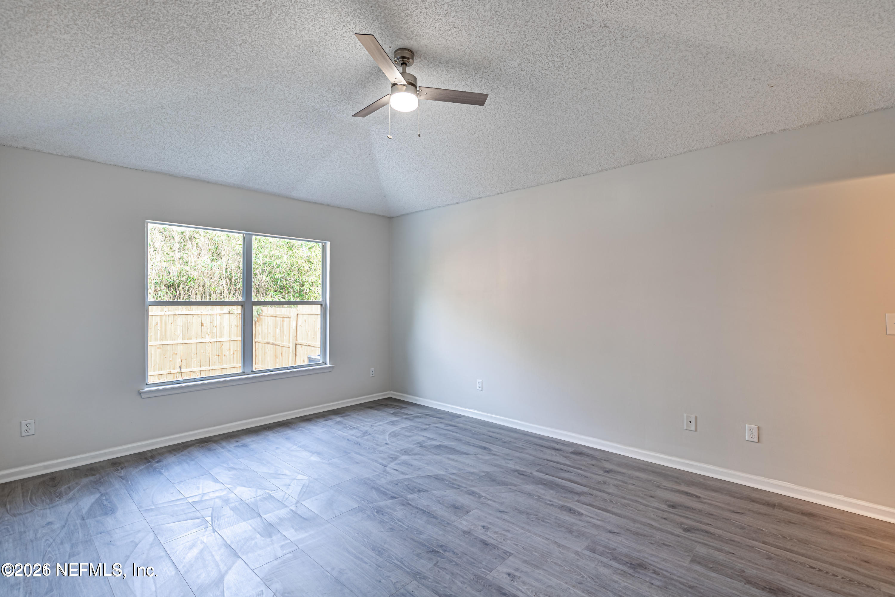 286 Main Street Atlantic Beach, FL 32233 - Photo 16 of 46 wooden floor in an empty room with a window