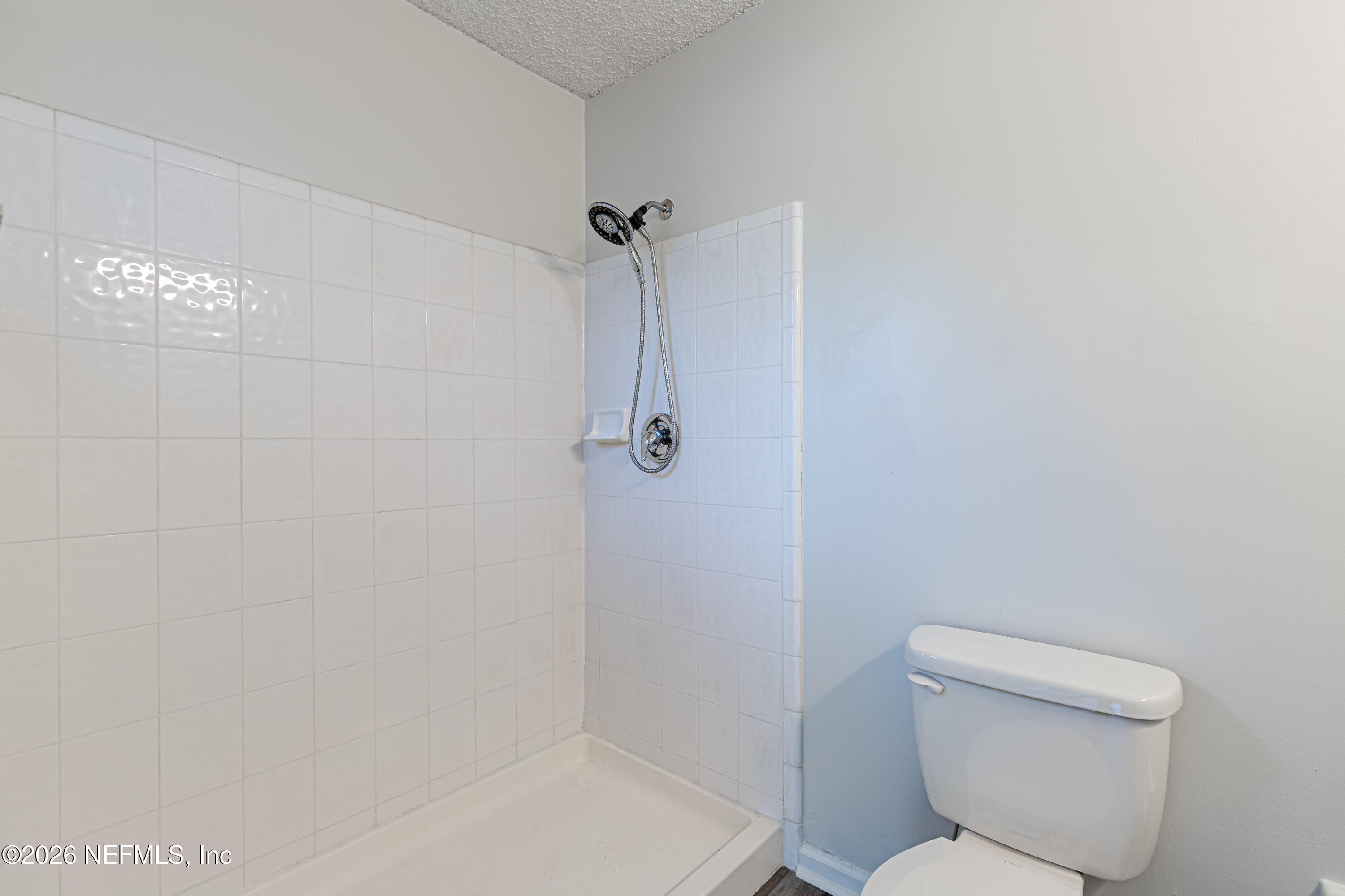 286 Main Street Atlantic Beach, FL 32233 - Photo 20 of 46 a bathroom with a toilet and shower