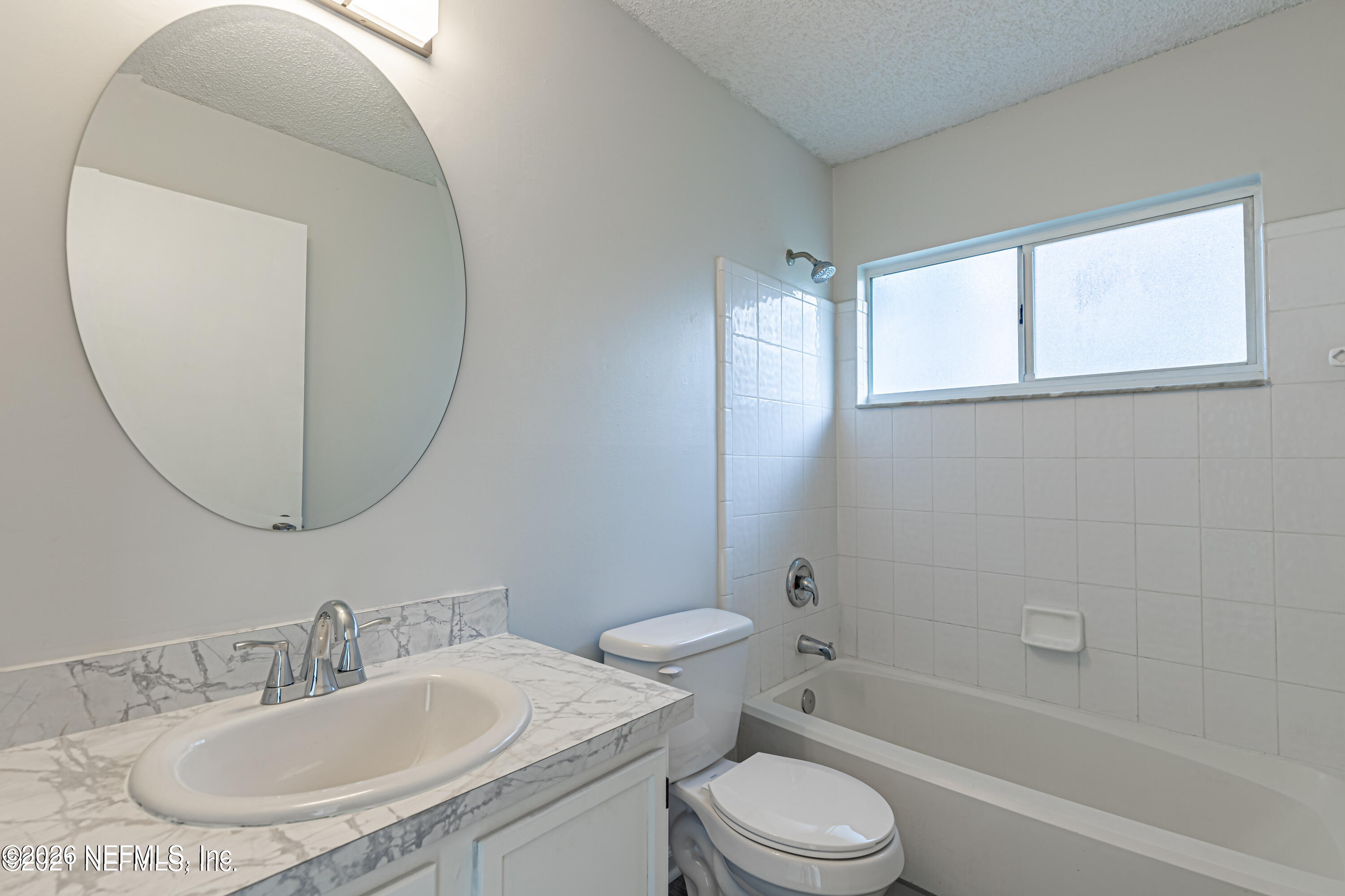286 Main Street Atlantic Beach, FL 32233 - Photo 23 of 46 a bathroom with a sink and a mirror