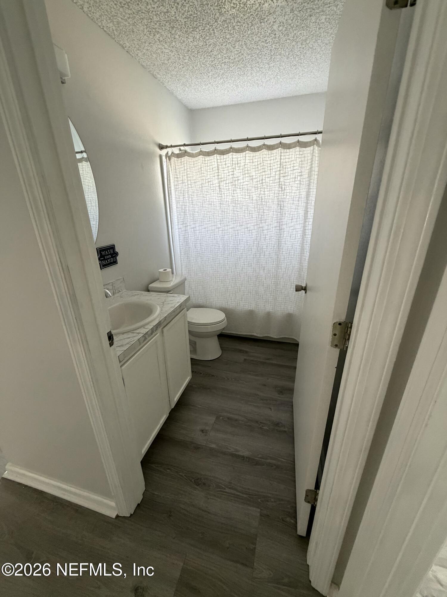 286 Main Street Atlantic Beach, FL 32233 - Photo 25 of 46 a bathroom with a sink a toilet and a shower