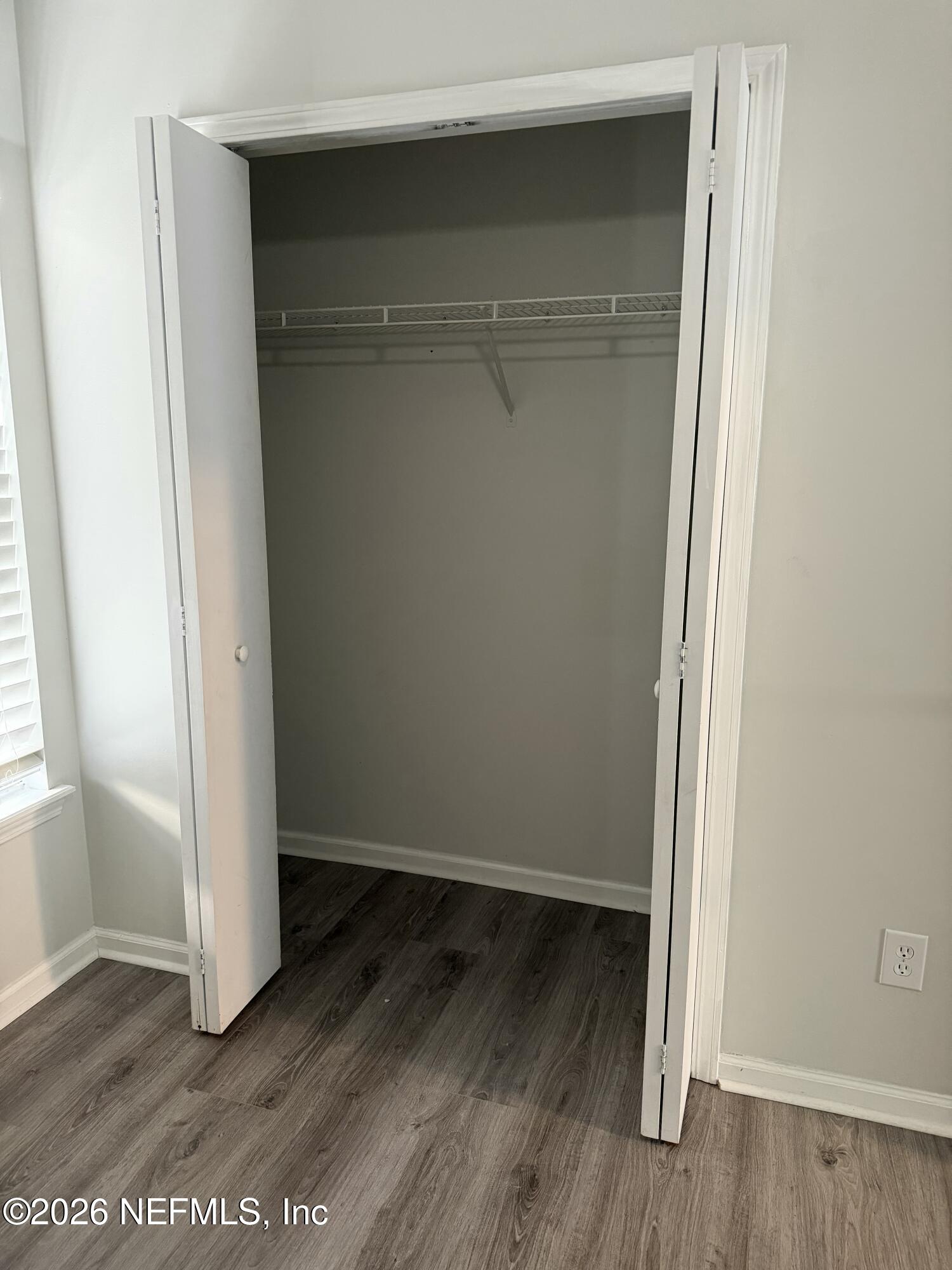 286 Main Street Atlantic Beach, FL 32233 - Photo 30 of 46 an empty room with wooden floor and closet