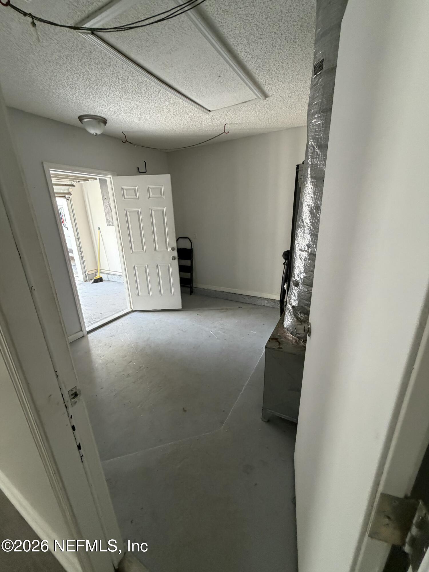 286 Main Street Atlantic Beach, FL 32233 - Photo 33 of 46 a view of an empty room with a window