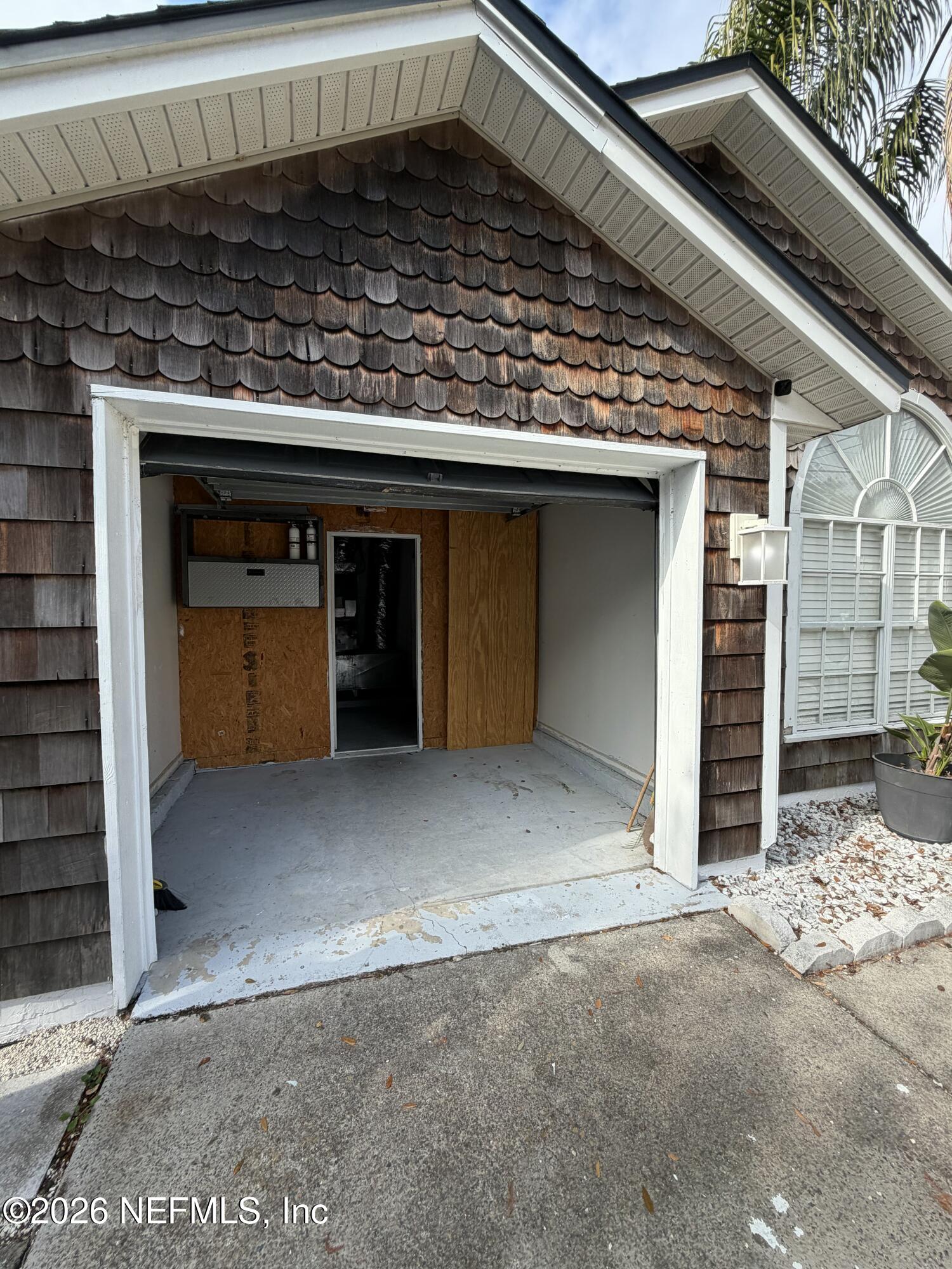 286 Main Street Atlantic Beach, FL 32233 - Photo 38 of 46 a view of a wooden door of the house