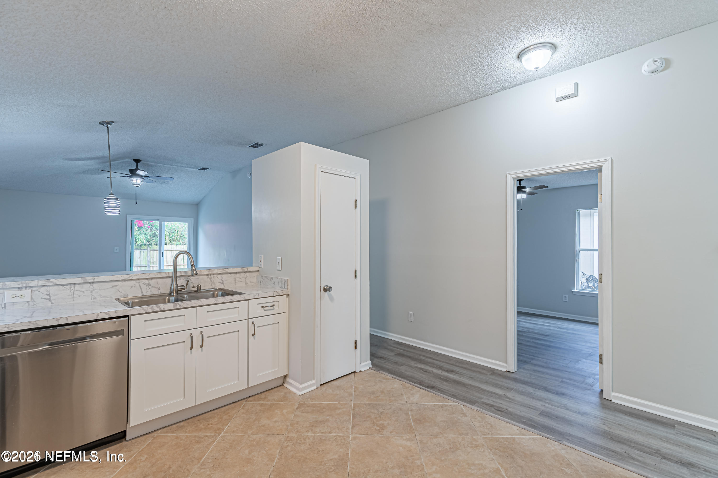 286 Main Street Atlantic Beach, FL 32233 - Photo 4 of 46 a kitchen with a sink dishwasher a refrigerator and cabinets
