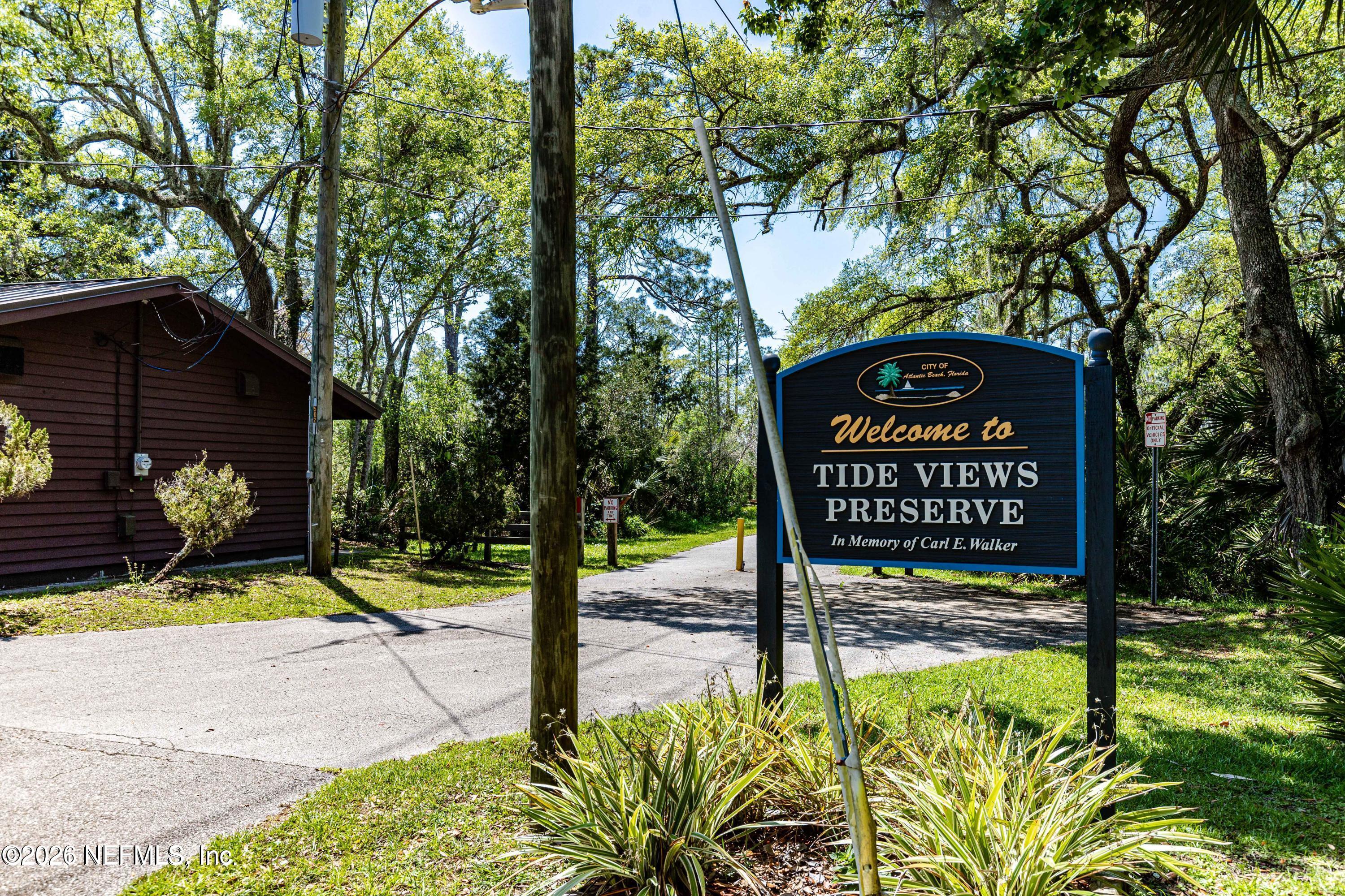 286 Main Street Atlantic Beach, FL 32233 - Photo 46 of 46 a view of a street sign under a large tree