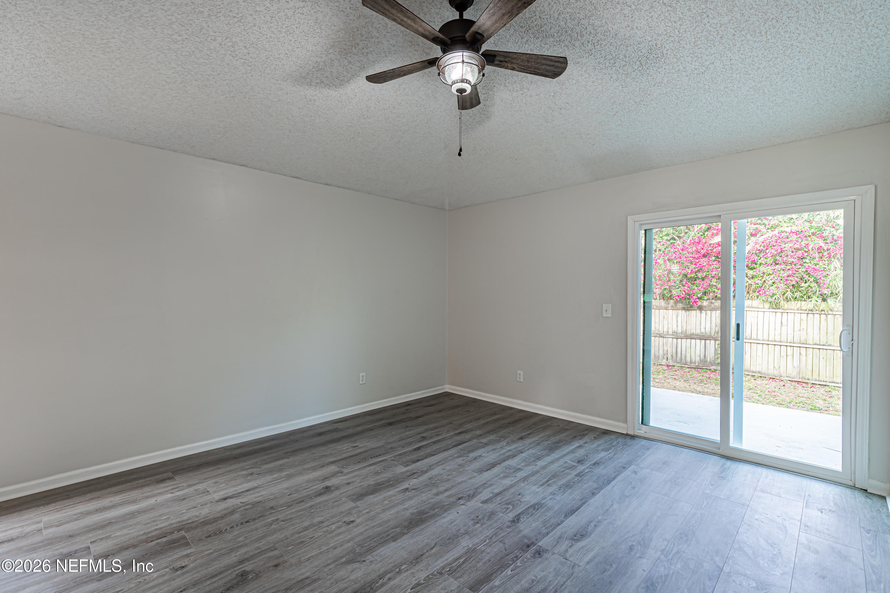 286 Main Street Atlantic Beach, FL 32233 - Photo 5 of 46 wooden floor in an empty room with a window