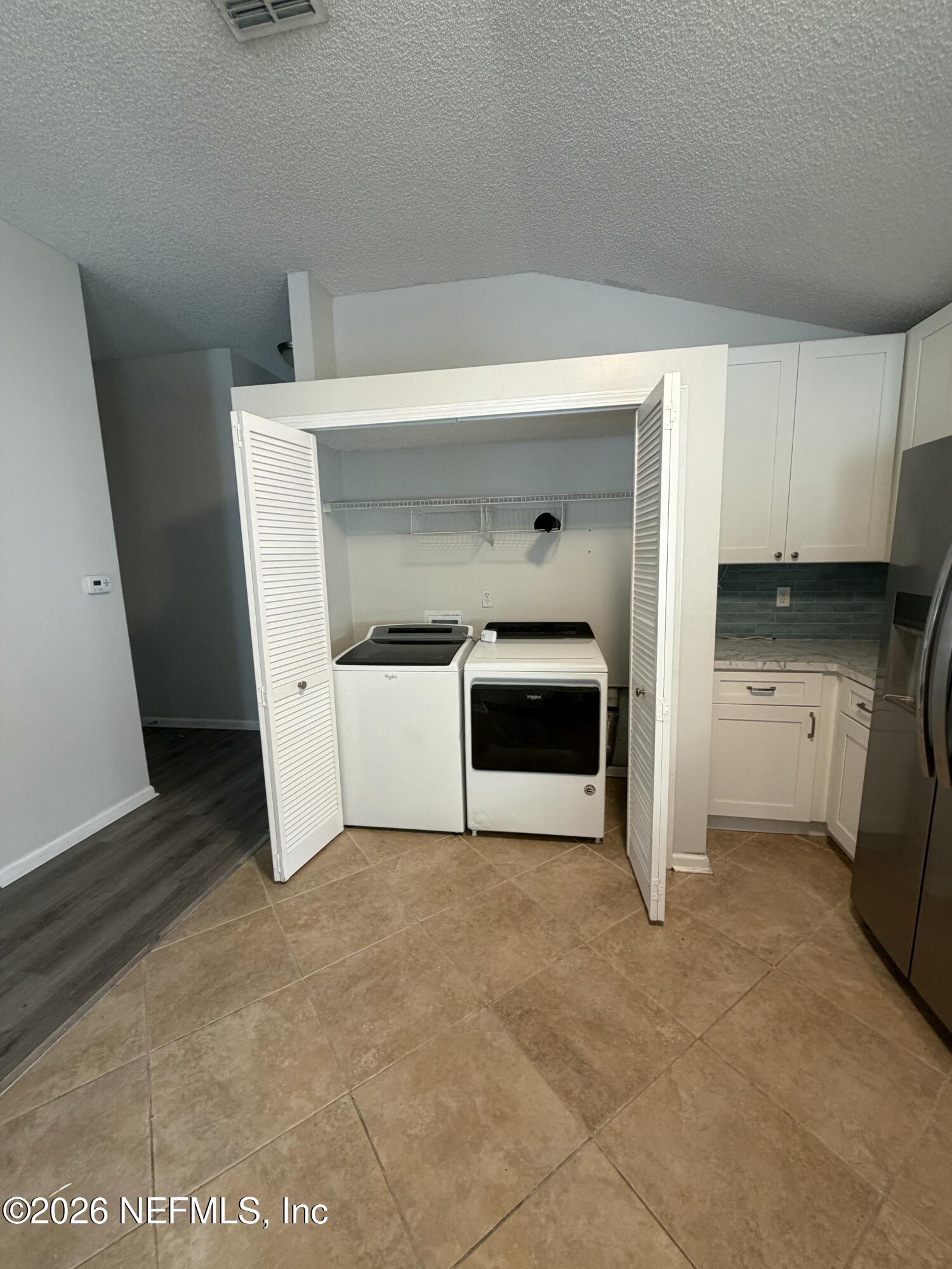 286 Main Street Atlantic Beach, FL 32233 - Photo 8 of 46 a view of an empty room with a fireplace
