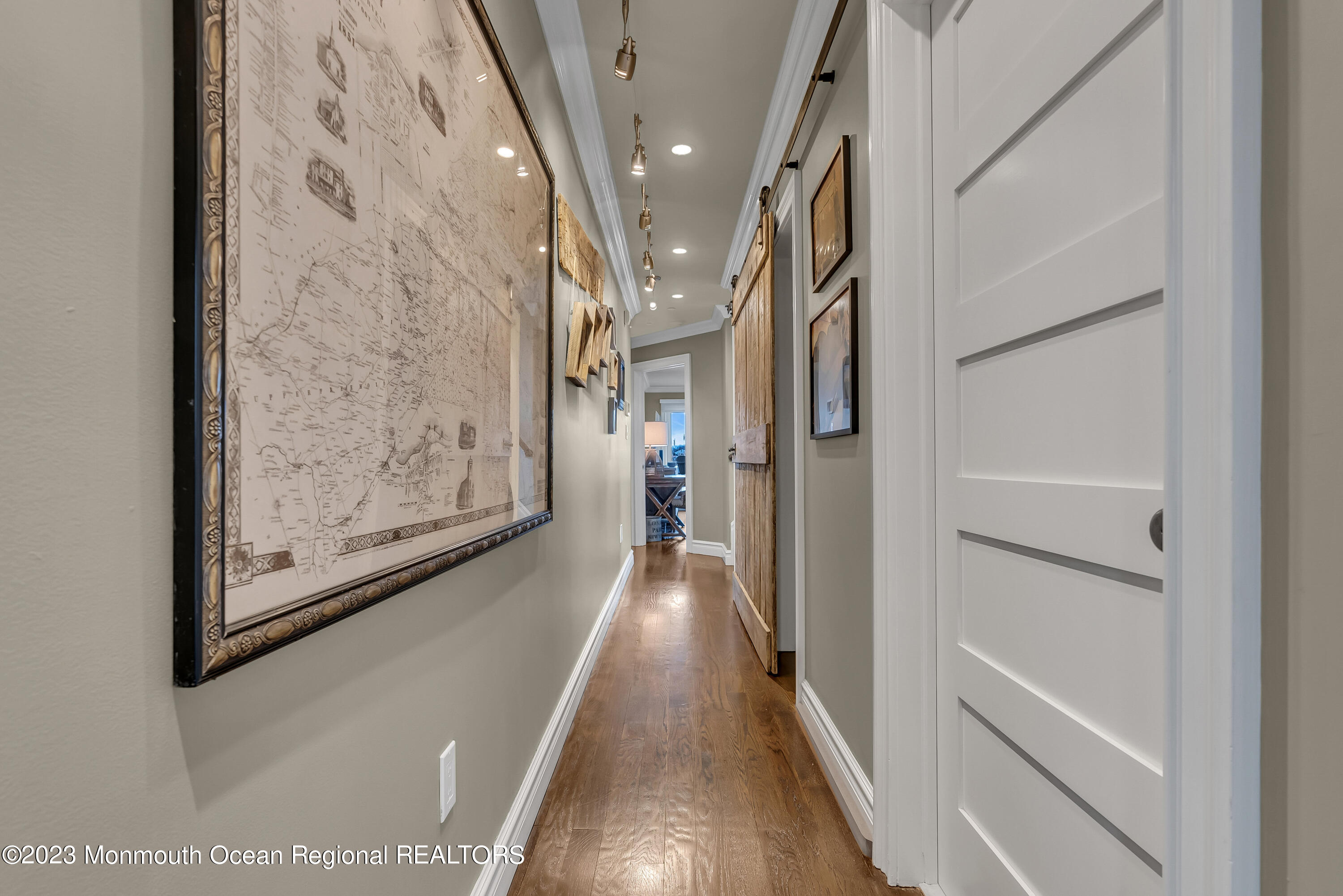 4 Waters Edge Brielle, NJ 08730 - Photo 18 of 66 a view of a hallway with wooden floor and staircase