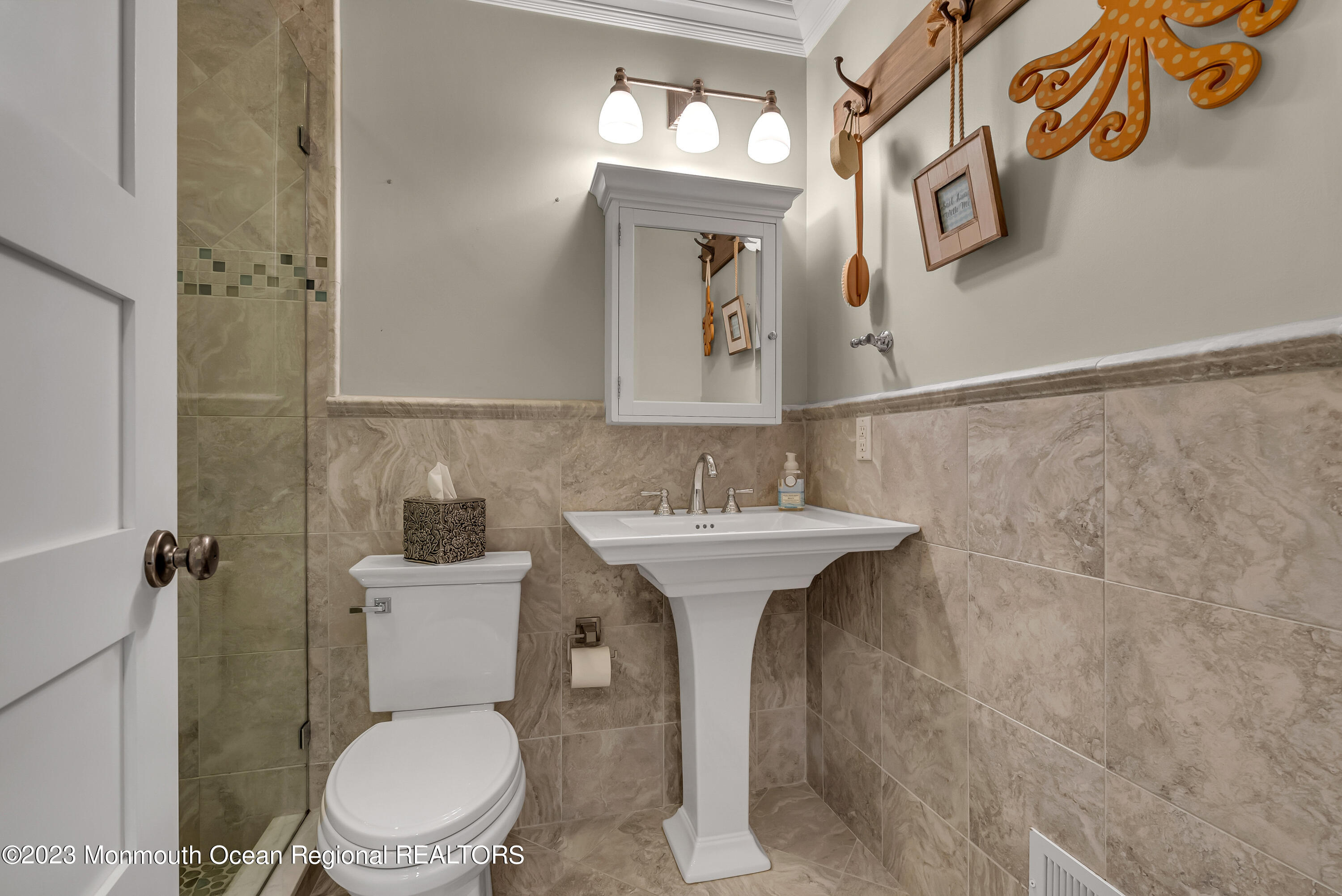 4 Waters Edge Brielle, NJ 08730 - Photo 19 of 66 a bathroom with a sink a toilet and mirror