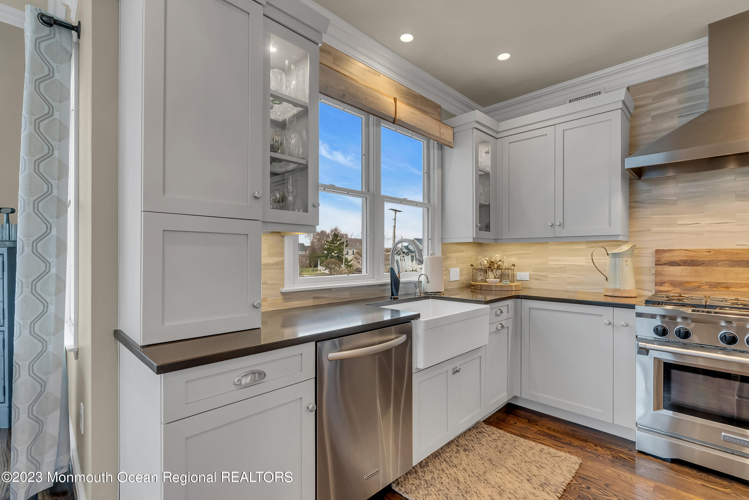 4 Waters Edge Brielle, NJ 08730 - Photo 32 of 66 a kitchen with stainless steel appliances granite countertop a sink and cabinets with wooden floor