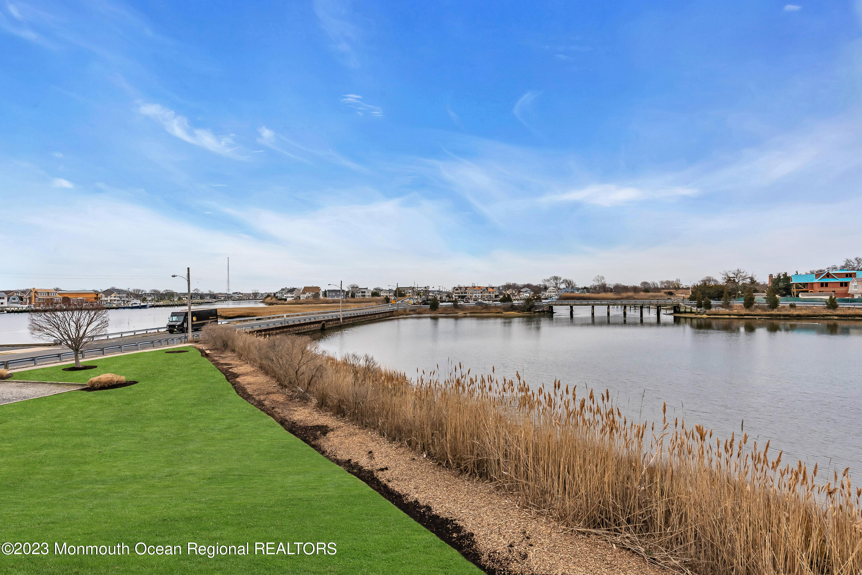 4 Waters Edge Brielle, NJ 08730 - Photo 56 of 66 a view of a lake with a city