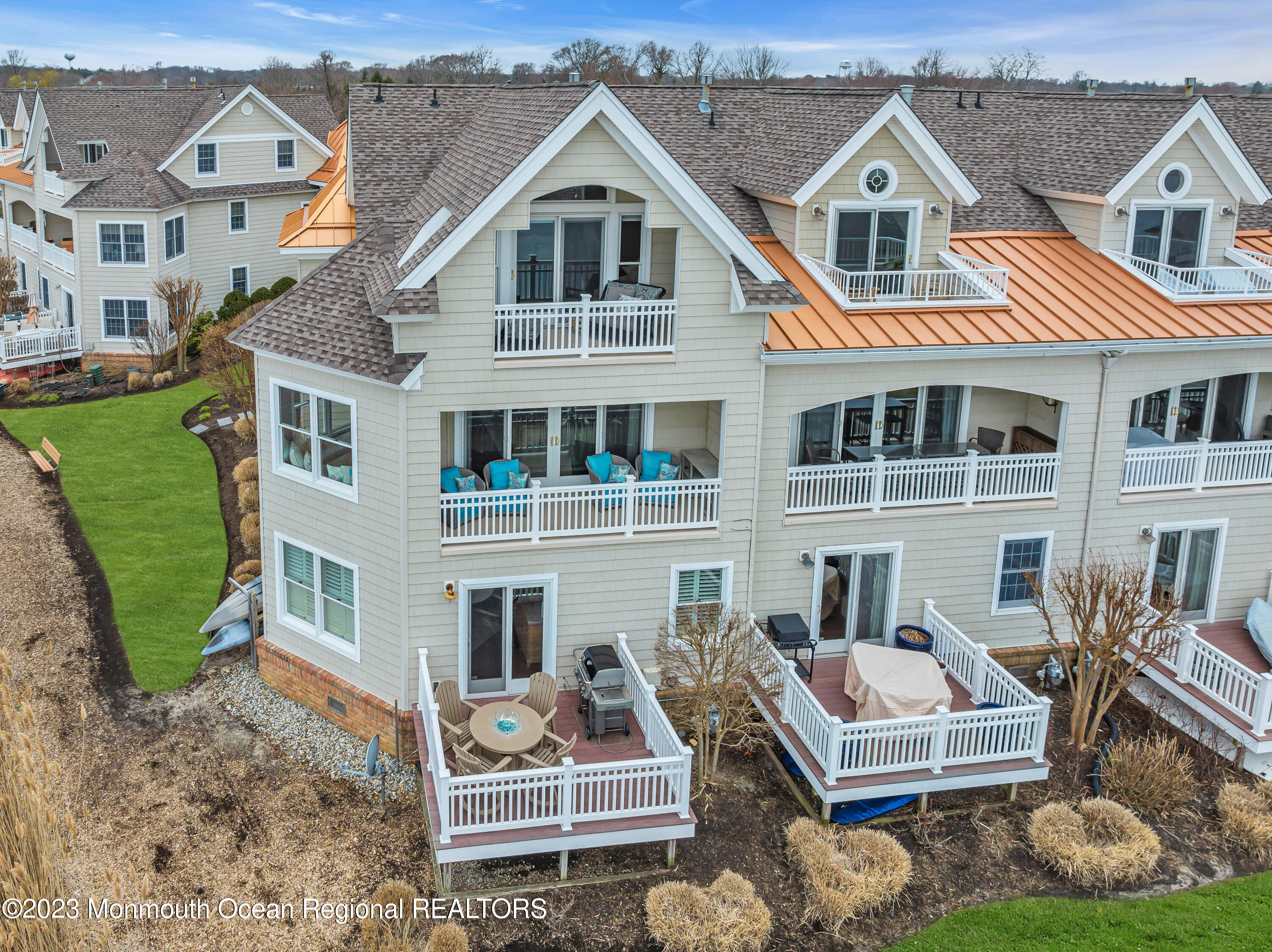 4 Waters Edge Brielle, NJ 08730 - Photo 59 of 66 a view of a white house with a yard and potted plants