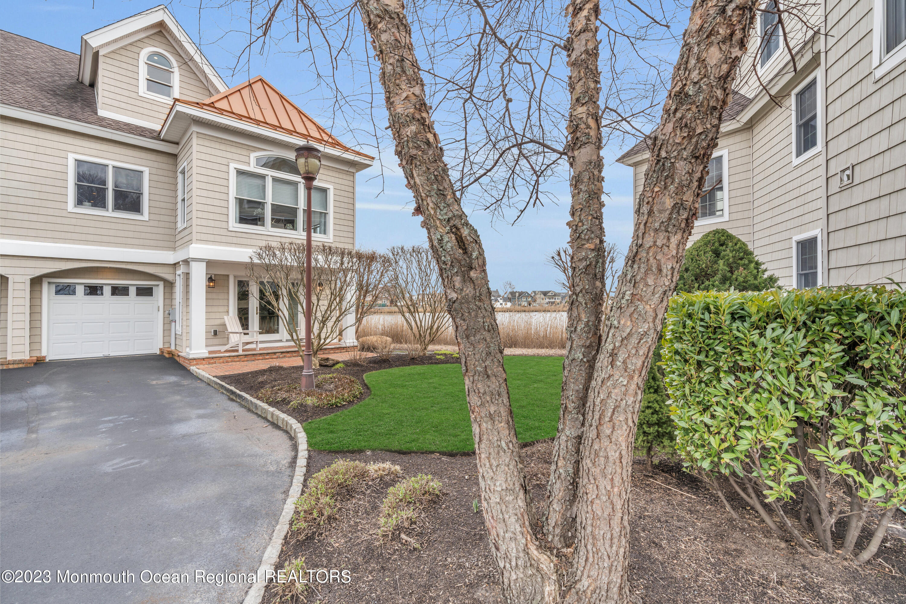 4 Waters Edge Brielle, NJ 08730 - Photo 9 of 66 a front view of a house with garden