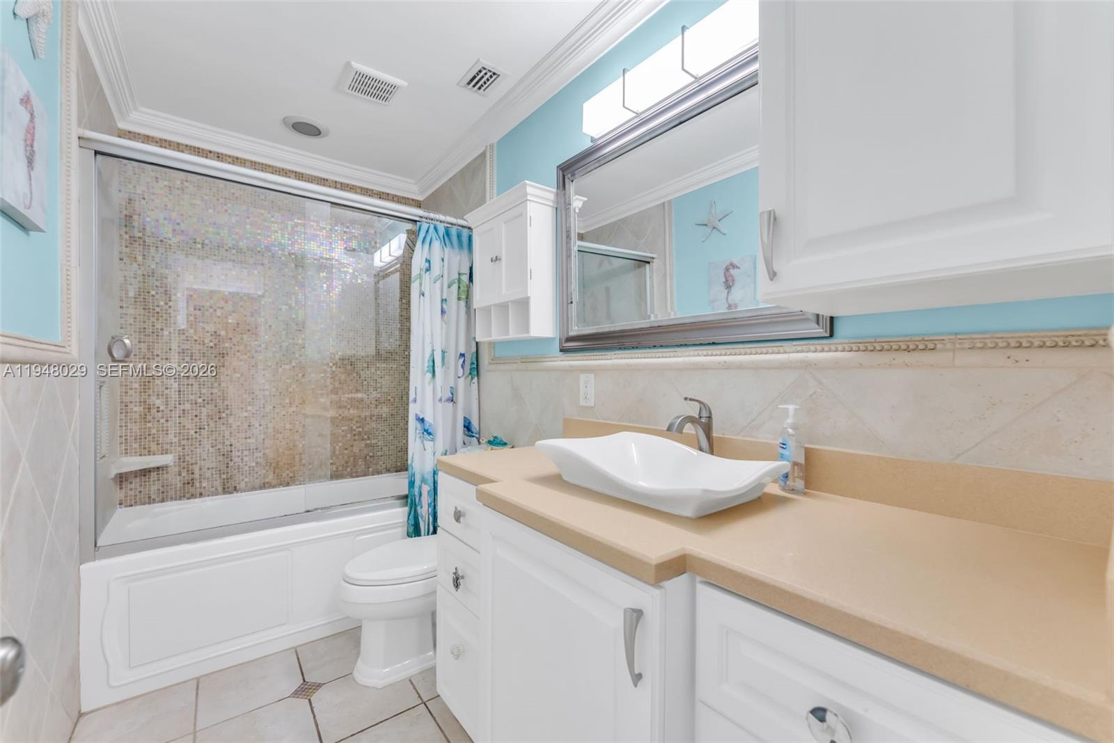 11628 Southwest 50th Street Cooper City, FL 33330 - Photo 16 of 22 a bathroom with a sink and a mirror