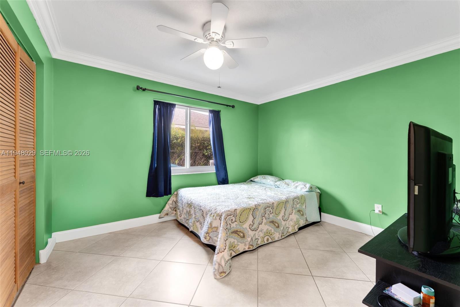 11628 Southwest 50th Street Cooper City, FL 33330 - Photo 17 of 22 a bedroom with a bed and a window
