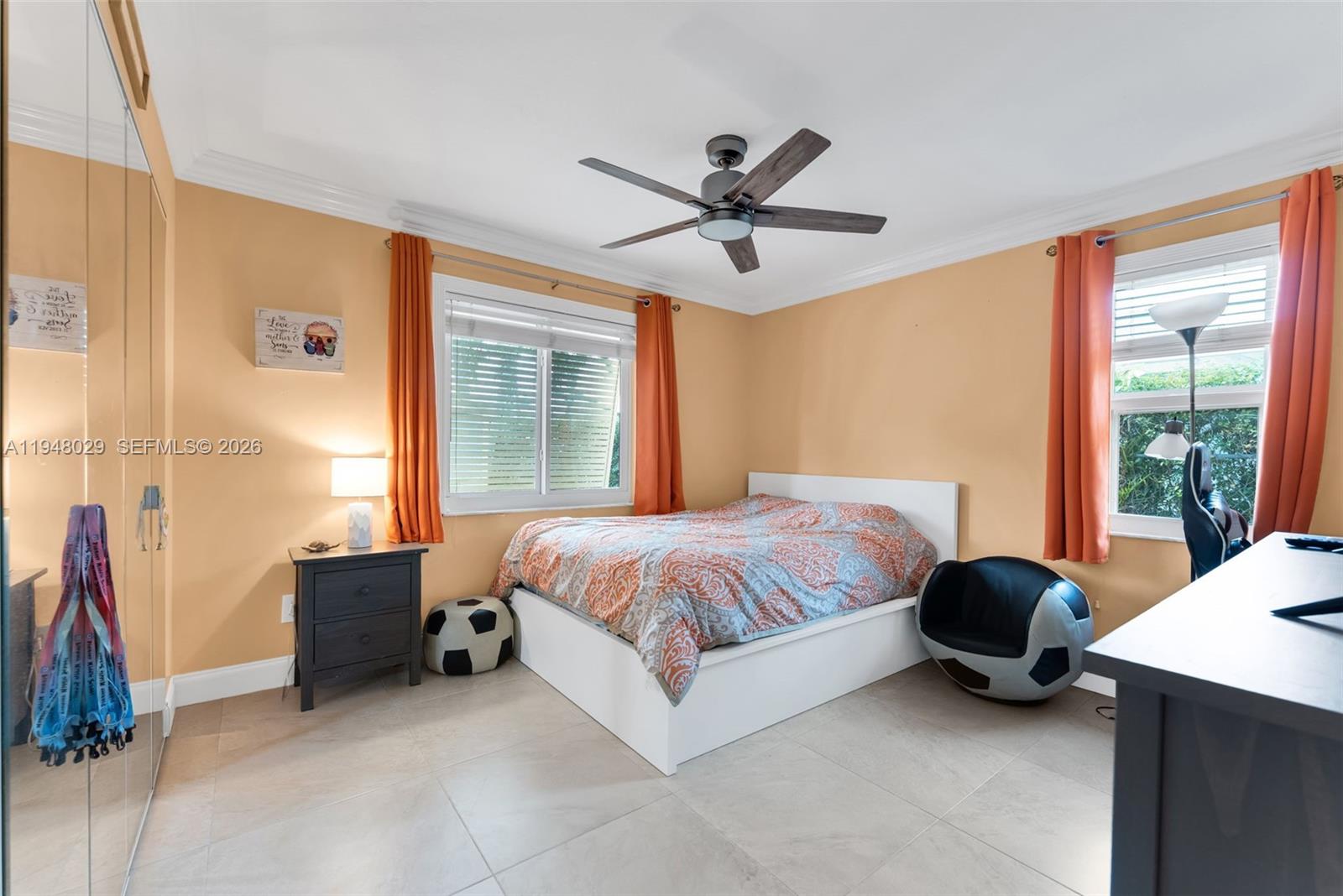 11628 Southwest 50th Street Cooper City, FL 33330 - Photo 18 of 22 a bedroom with a bed and a large window