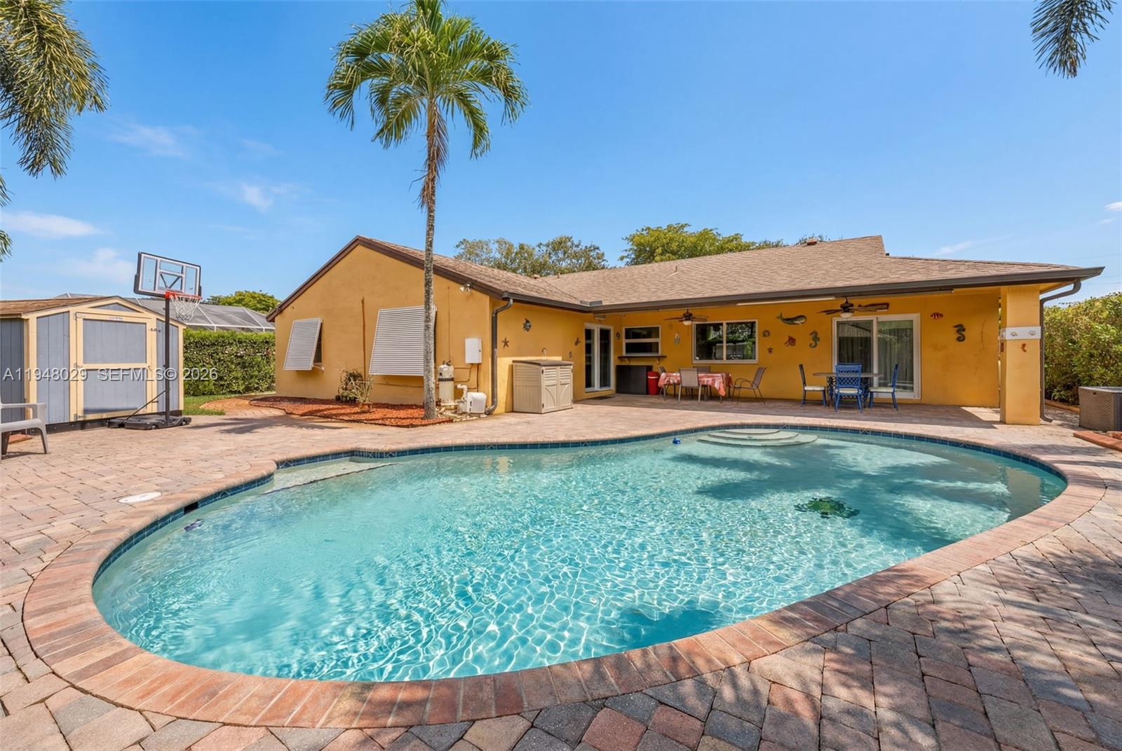 11628 Southwest 50th Street Cooper City, FL 33330 - Photo 2 of 22 a view of a house with a backyard porch and sitting area