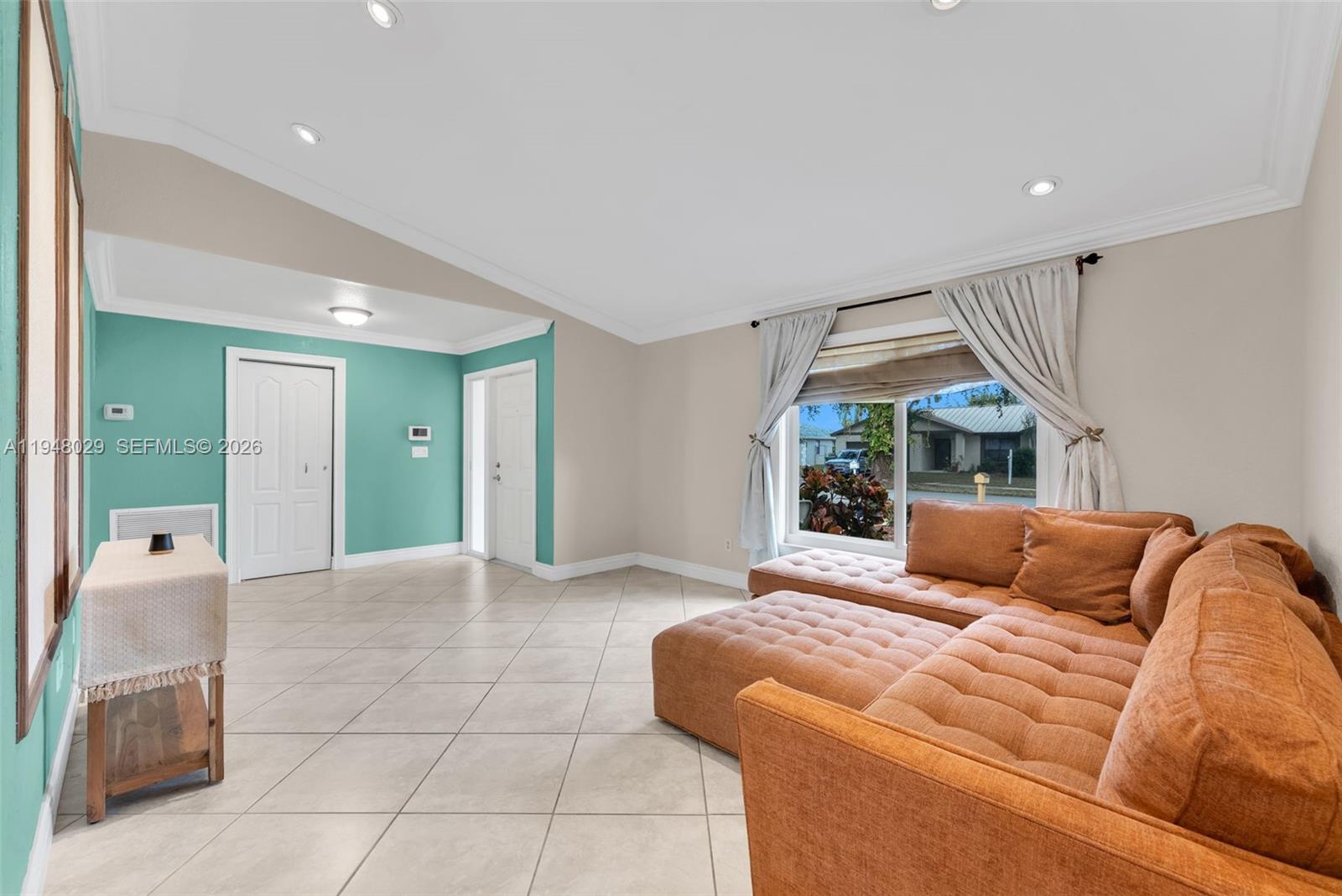 11628 Southwest 50th Street Cooper City, FL 33330 - Photo 6 of 22 a bedroom with a bed and a couch