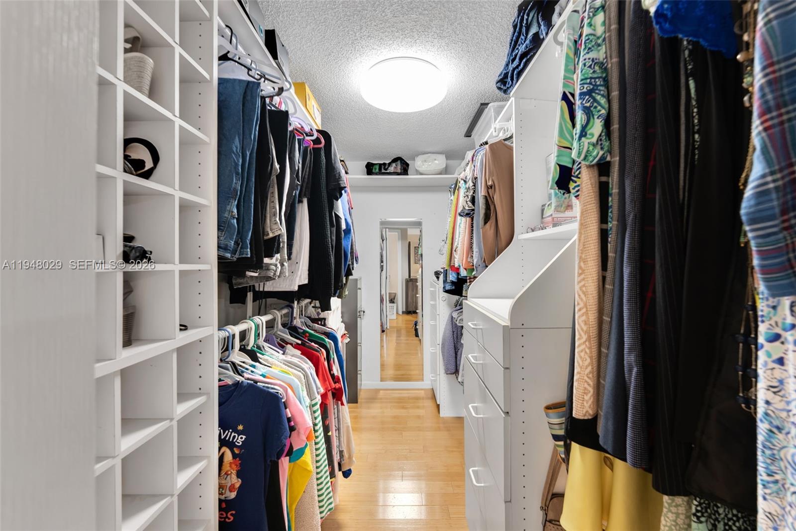 11628 Southwest 50th Street Cooper City, FL 33330 - Photo 7 of 22 a view of walk in closet with clothes and shoes
