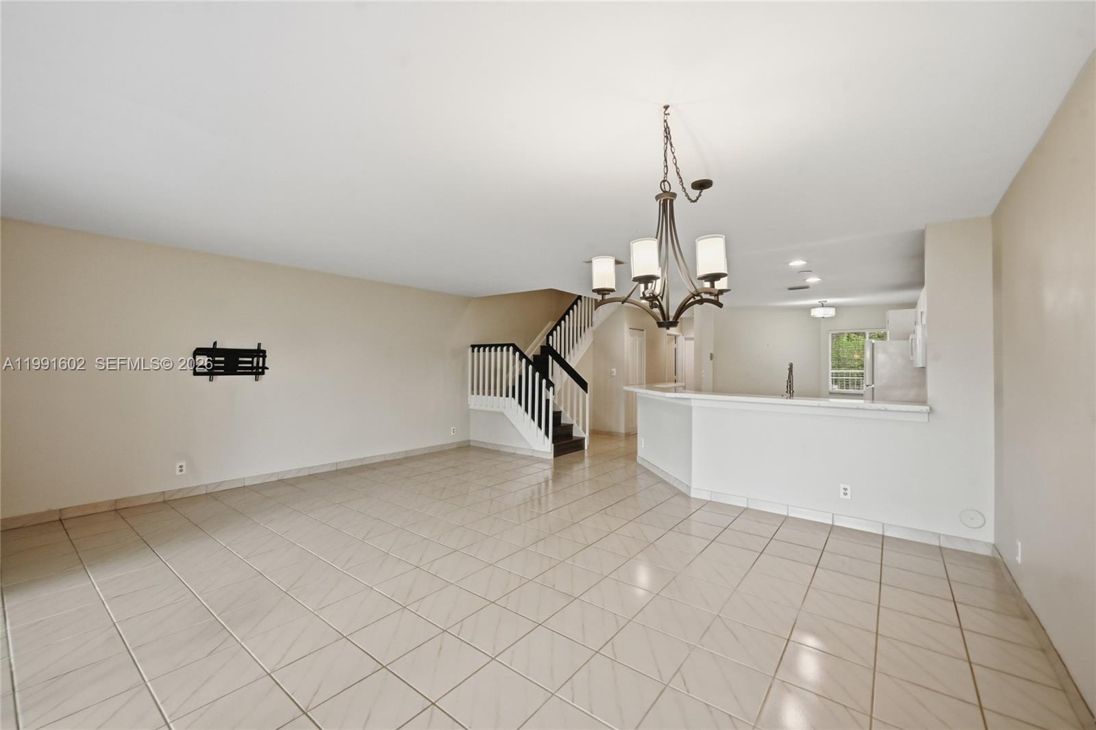 6215 Old Court Road, Unit 505 Boca Raton, FL 33433 - Photo 12 of 36 a view of an empty room with chandelier fan