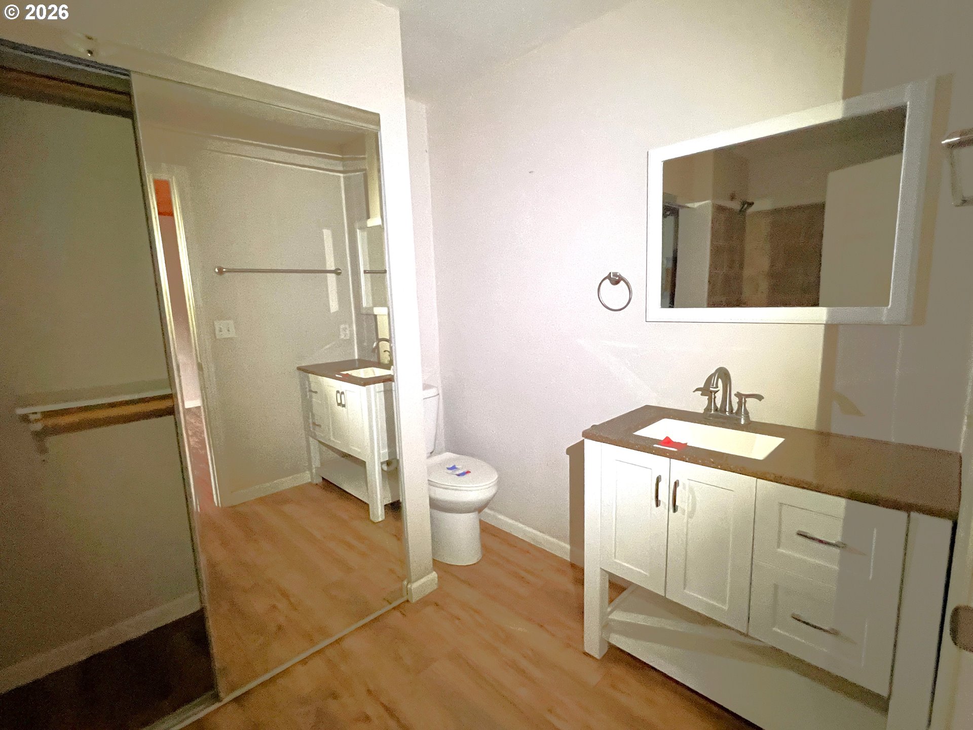 94191 10th Street Gold Beach, OR 97444 - Photo 13 of 33 a bathroom with a sink a toilet and a mirror