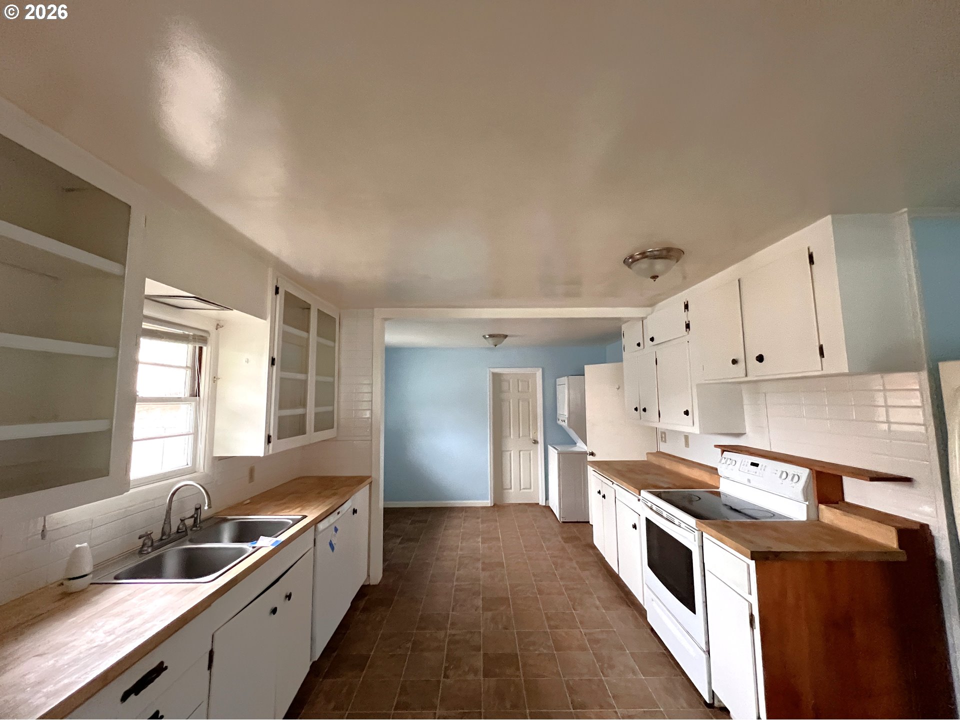 94191 10th Street Gold Beach, OR 97444 - Photo 18 of 33 a kitchen with granite countertop a sink a counter top space and stainless steel appliances