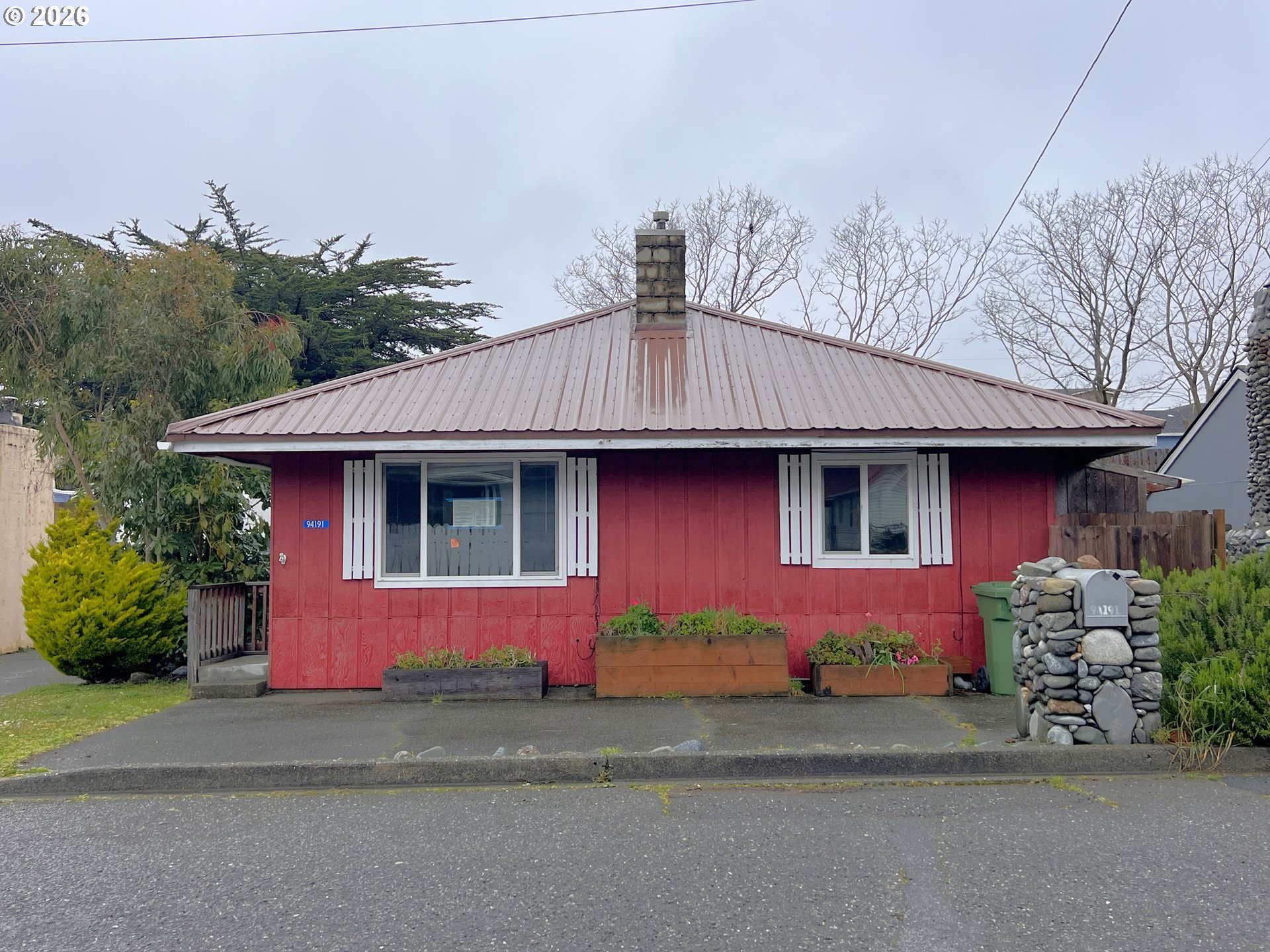 94191 10th Street Gold Beach, OR 97444 - Photo 2 of 33 a front view of a house with a yard