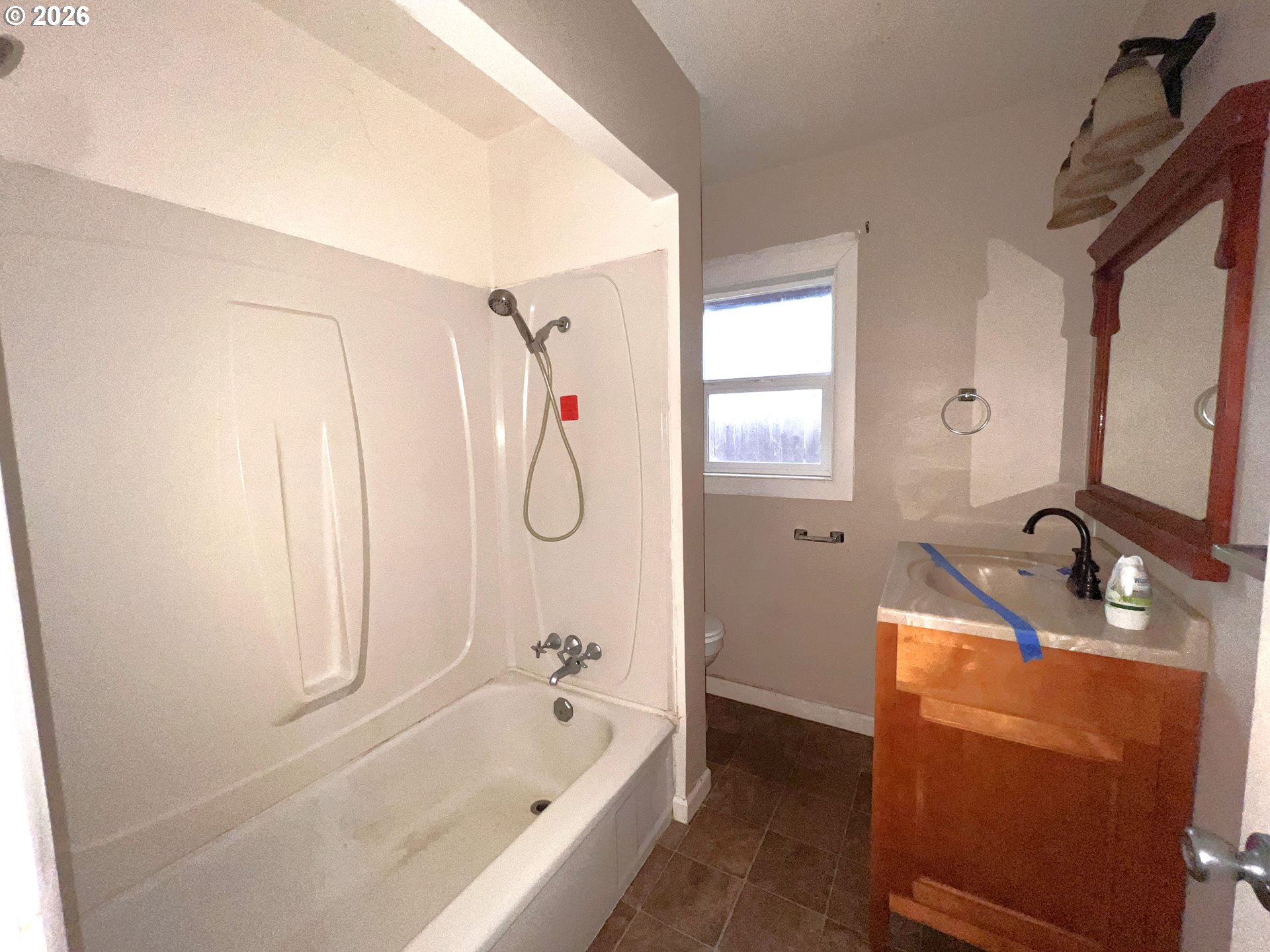 94191 10th Street Gold Beach, OR 97444 - Photo 24 of 33 a bathroom with a tub sink and mirror
