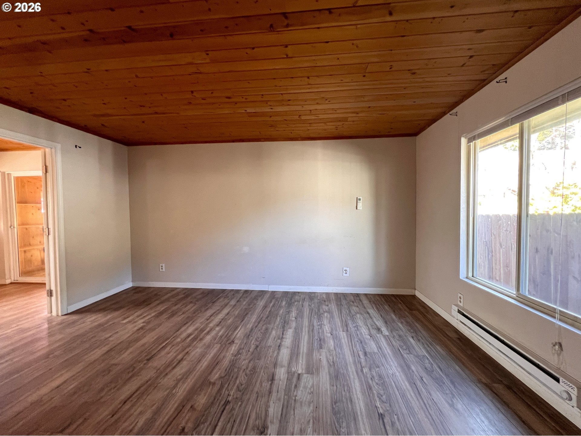 94191 10th Street Gold Beach, OR 97444 - Photo 29 of 33 a view of empty room with wooden floor and fan