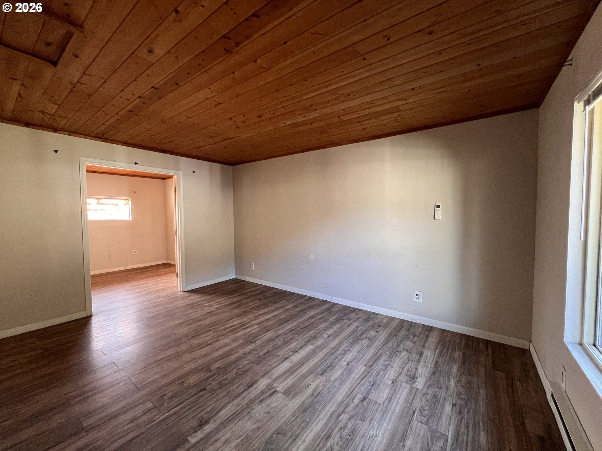 94191 10th Street Gold Beach, OR 97444 - Photo 30 of 33 a view of empty room with wooden floor and fan