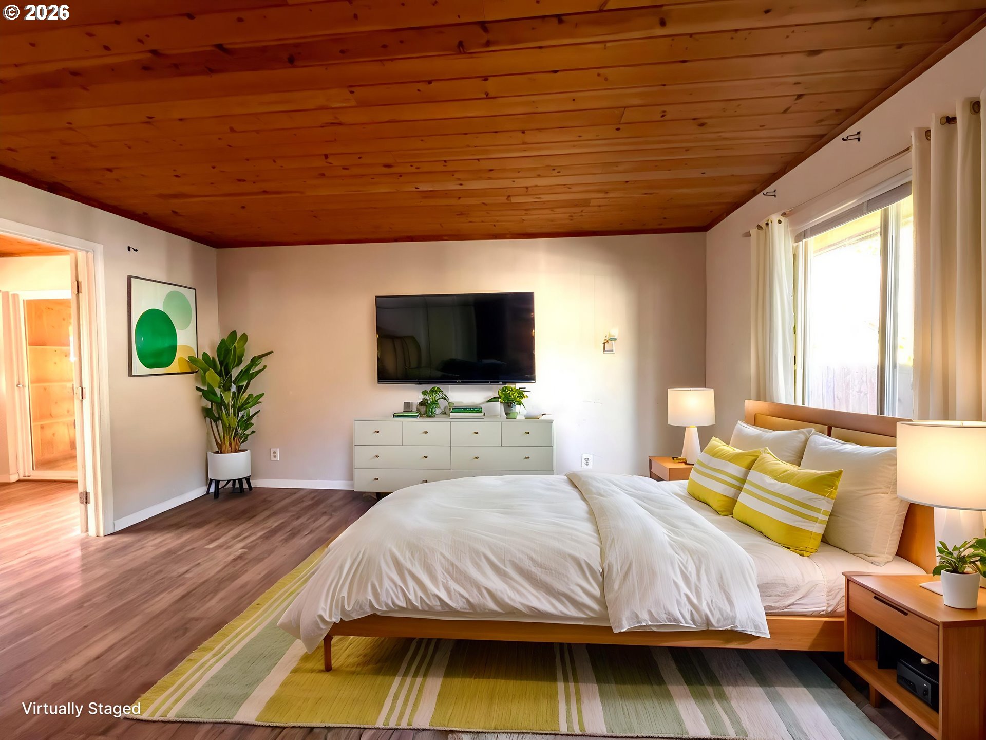 94191 10th Street Gold Beach, OR 97444 - Photo 33 of 33 a spacious bedroom with a bed and a flat screen tv