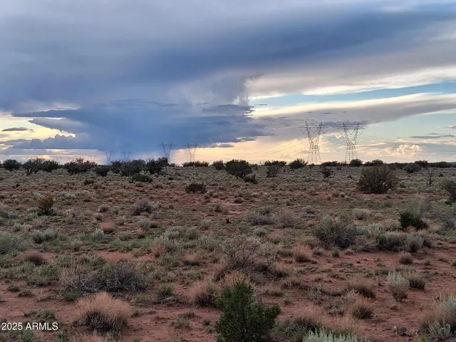 a view of a building with mountains in the background