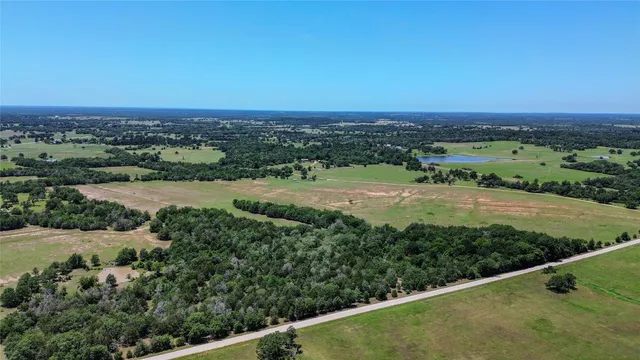 an aerial view of a houses with outdoor space and street view