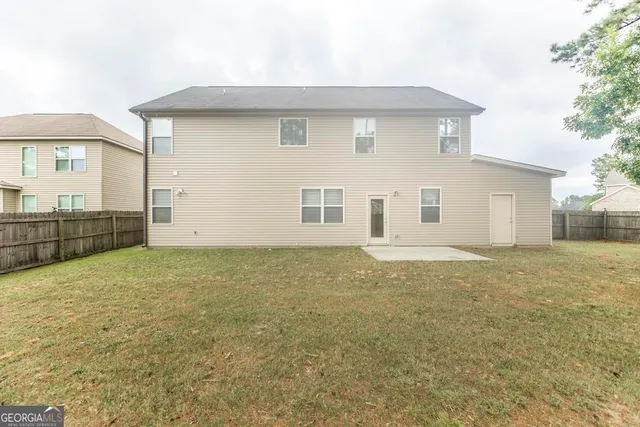 a backyard of a house with lots of green space