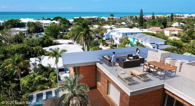 aerial view of a house with balcony and outdoor space