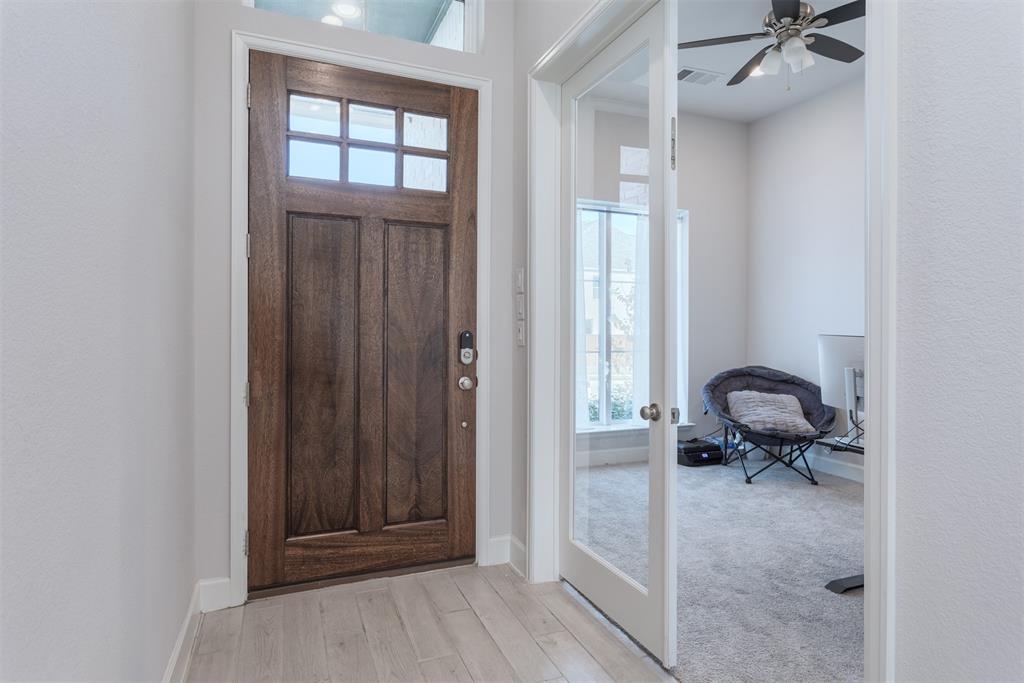9110 Copperhead Road Little Elm, TX 75068 - Photo 3 of 35 a view of a livingroom with furniture and a window
