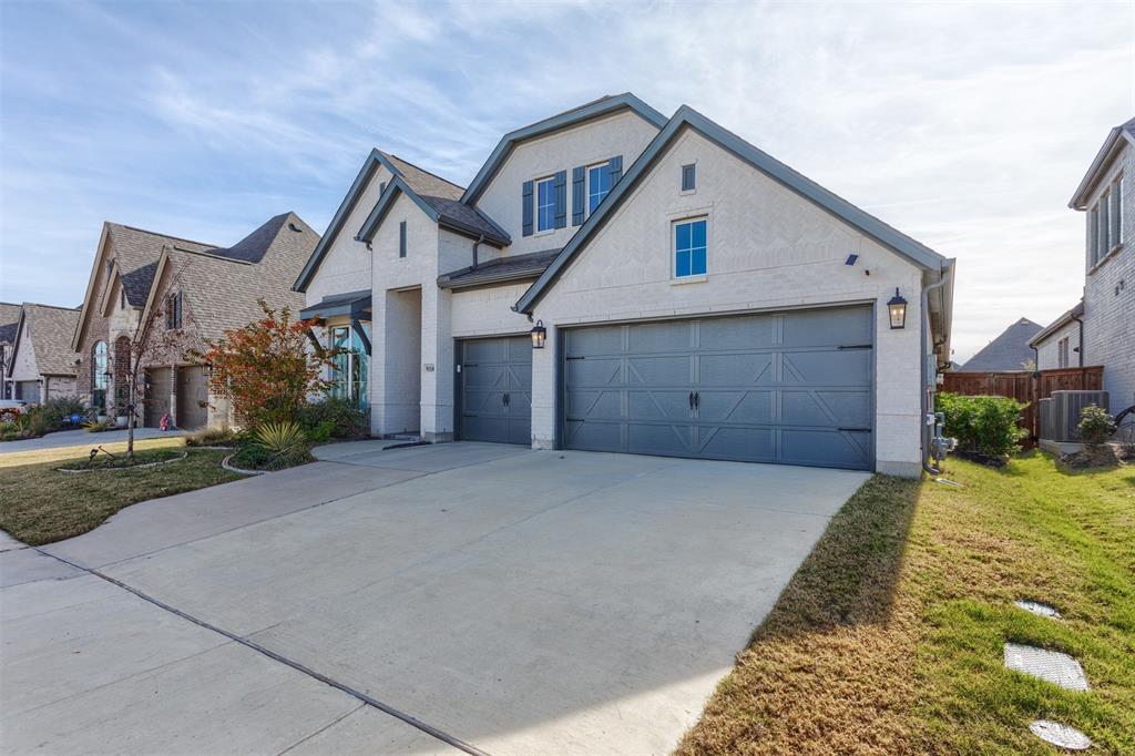 9110 Copperhead Road Little Elm, TX 75068 - Photo 34 of 35 a front view of a house with garden