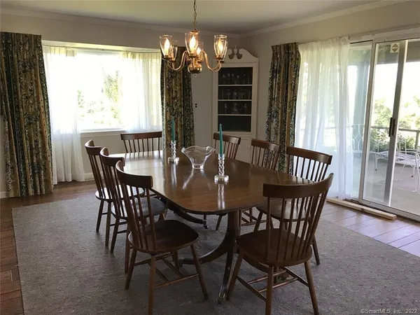 a view of a dining room with furniture window and outside view