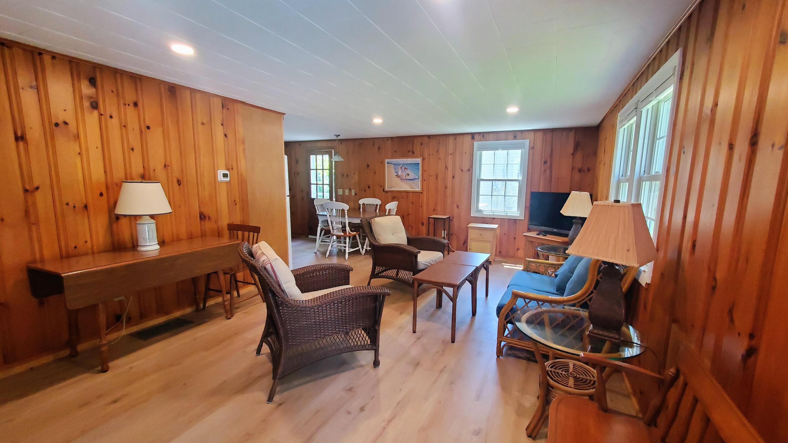 66 Uncle Edwards Road Mashpee, MA 02649 - Photo 3 of 18 a view of a livingroom with furniture window and wooden floor