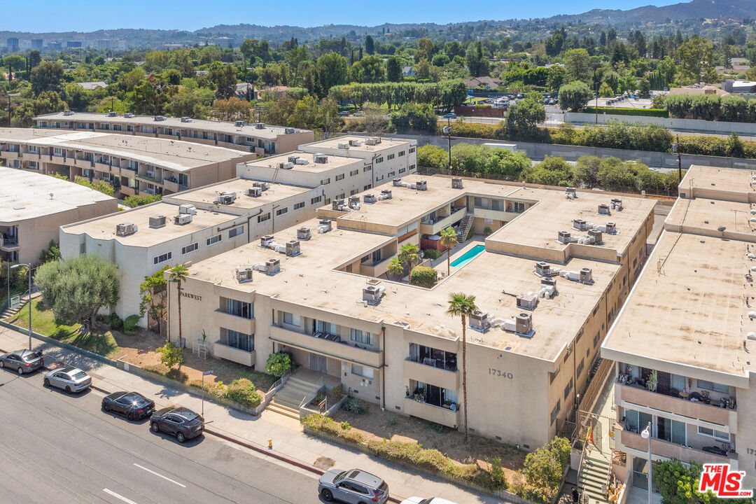 17340 Burbank Boulevard Encino, CA 91316 - Photo 5 of 24 an aerial view of a building with garden space and mountain view