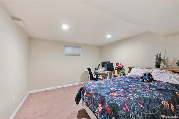 a bed room with a bed and a dresser