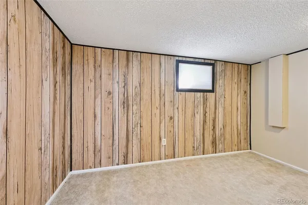 a view of a room with a wooden door